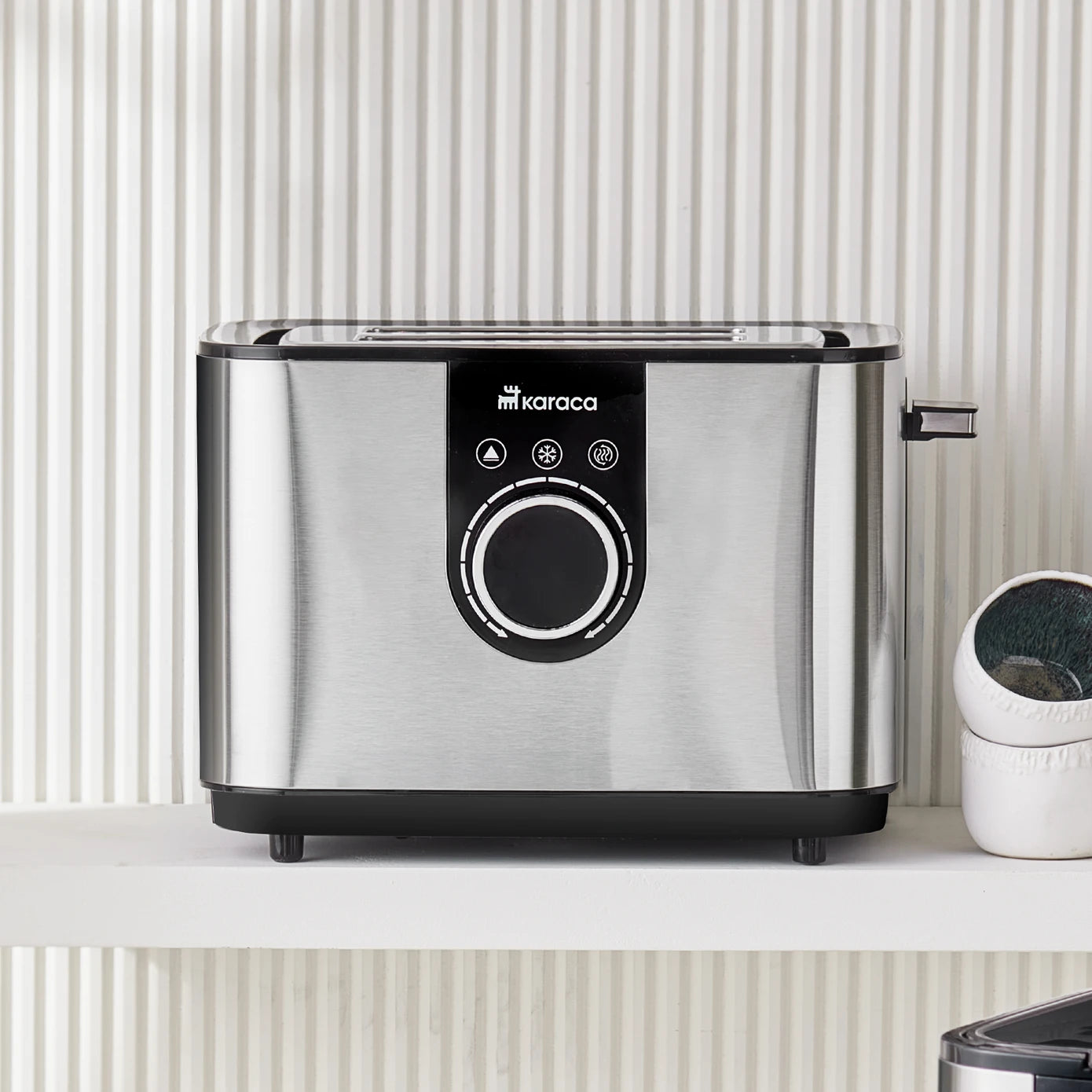 Karaca Inox Toaster 2303 kitchen appliance with stainless steel finish, featuring wide slots for bread and modern design.