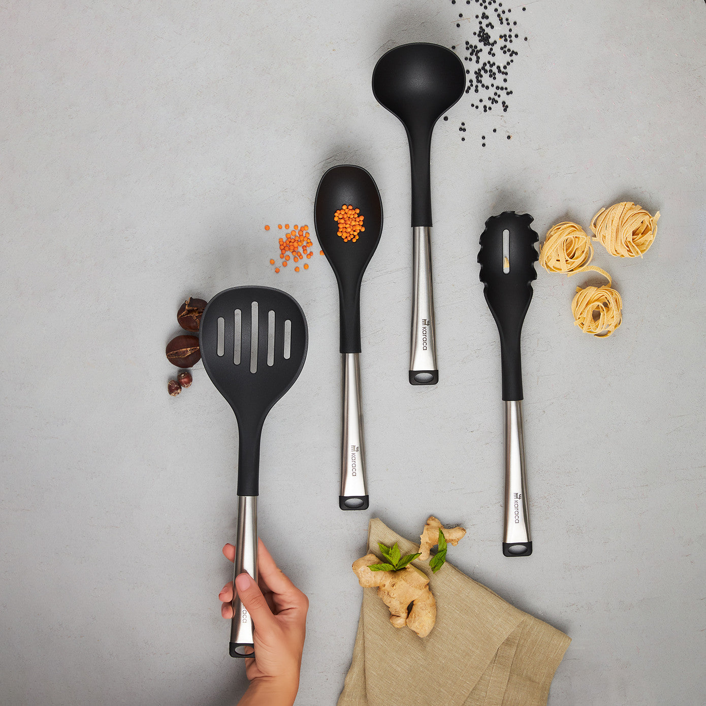 Karaca Luna 4-piece service set with elegant dinnerware and utensils, perfect for serving meals in a modern kitchen setting.