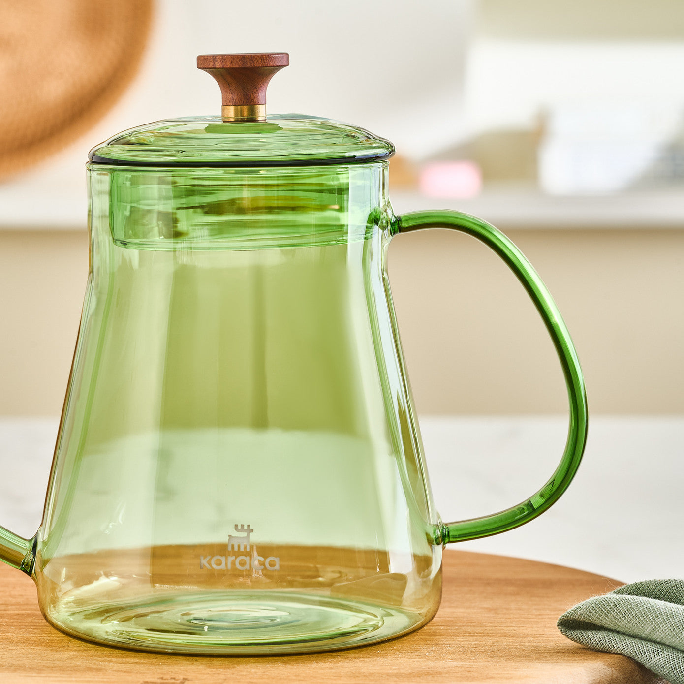 Green Karaca Martina borosilicate glass coffee kettle with 600ml capacity, designed for brewing coffee and tea.