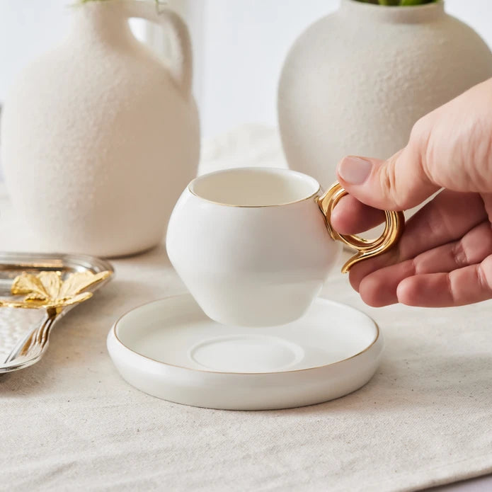 Karaca Venus Gold set of 2 coffee cups, 135 ml, with elegant gold accents, made of fine ceramic for stylish coffee service.