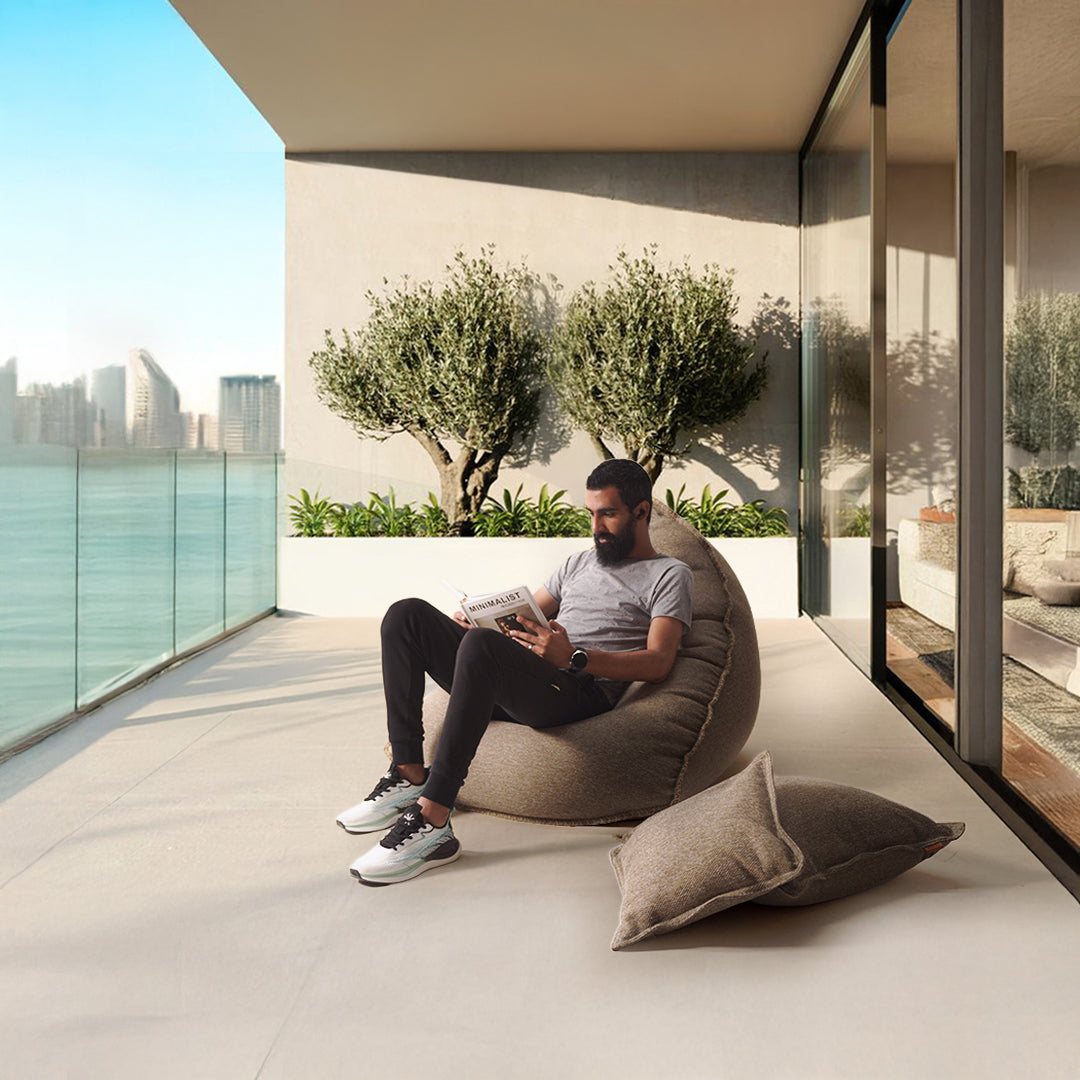 Brown La-Concha Sunproof 100% Olefin Bean Bag by BEACON, with plush fabric and casual design for outdoor lounging.