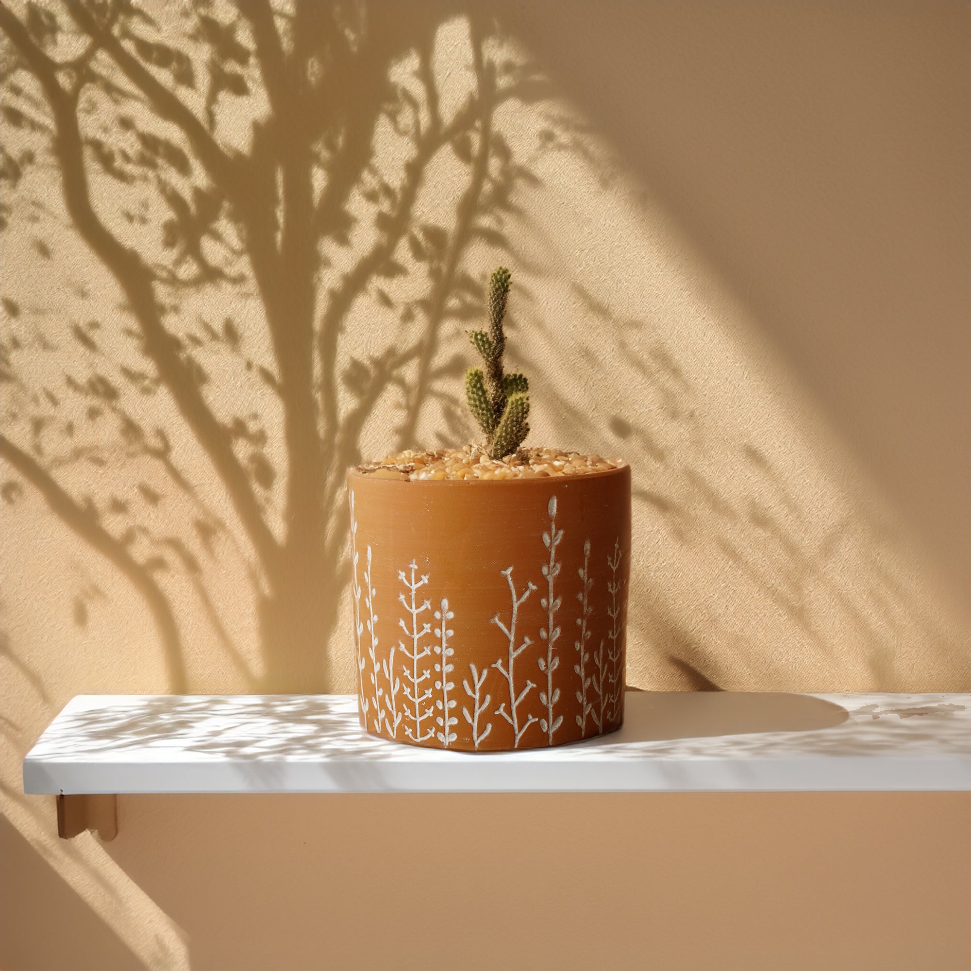 Terracotta leafy branch outdoor and indoor planter box by BEACON, ideal for garden or home decor, durable and stylish.
