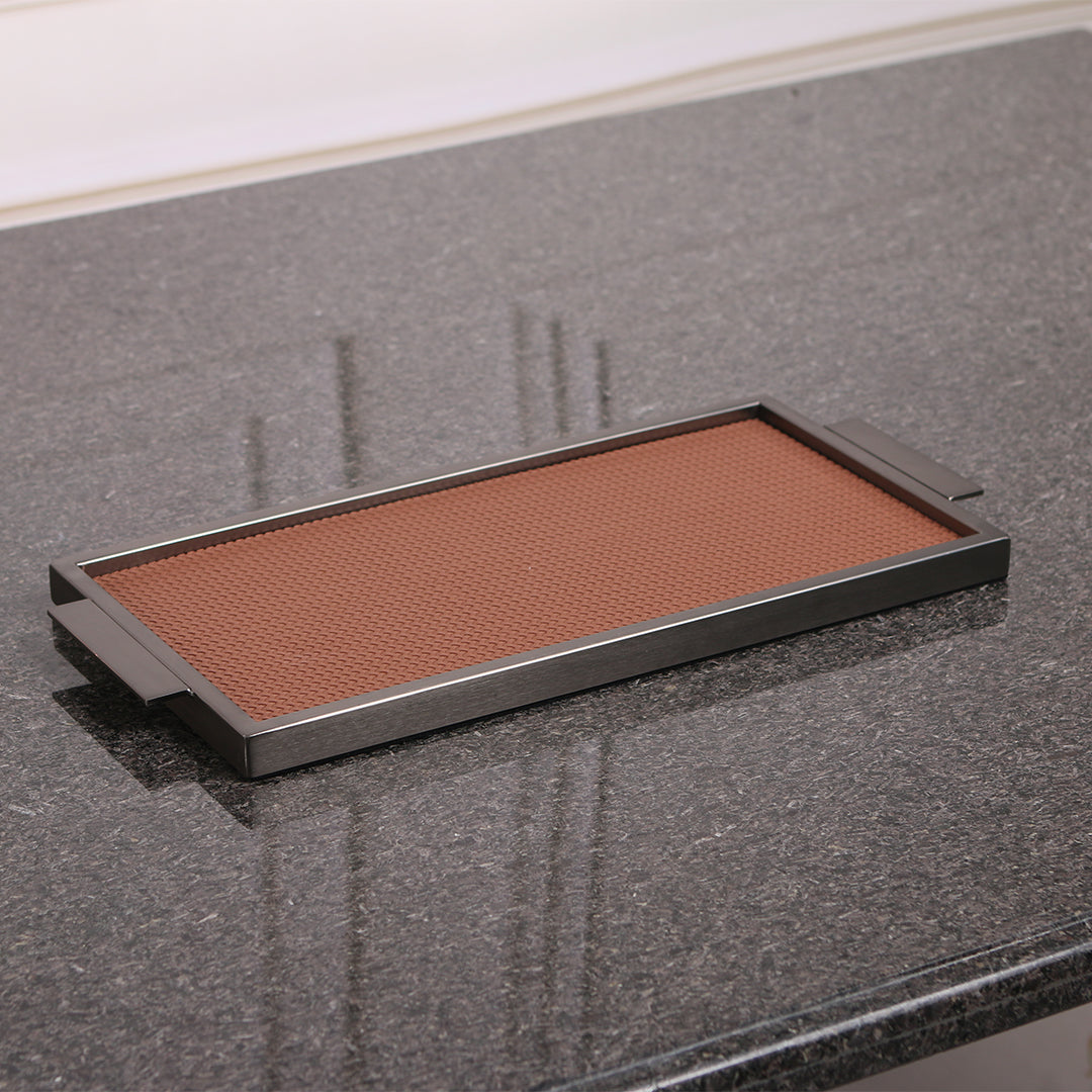 Brown leather and metal tray by Beacon with a sleek design, perfect for serving or decorative use.