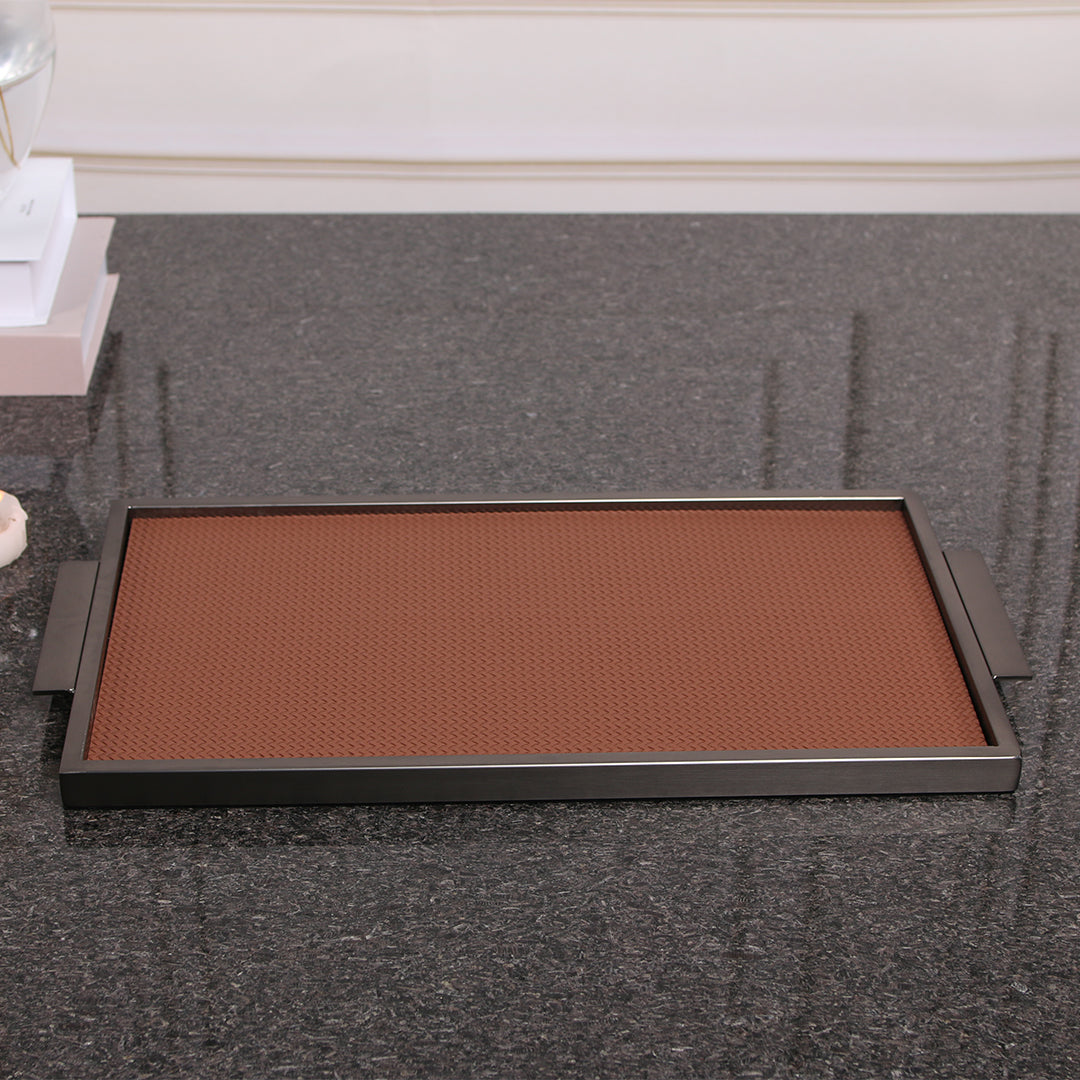 Brown leather and metal tray by BEACON, featuring a sleek rectangular design with sturdy metal handles.