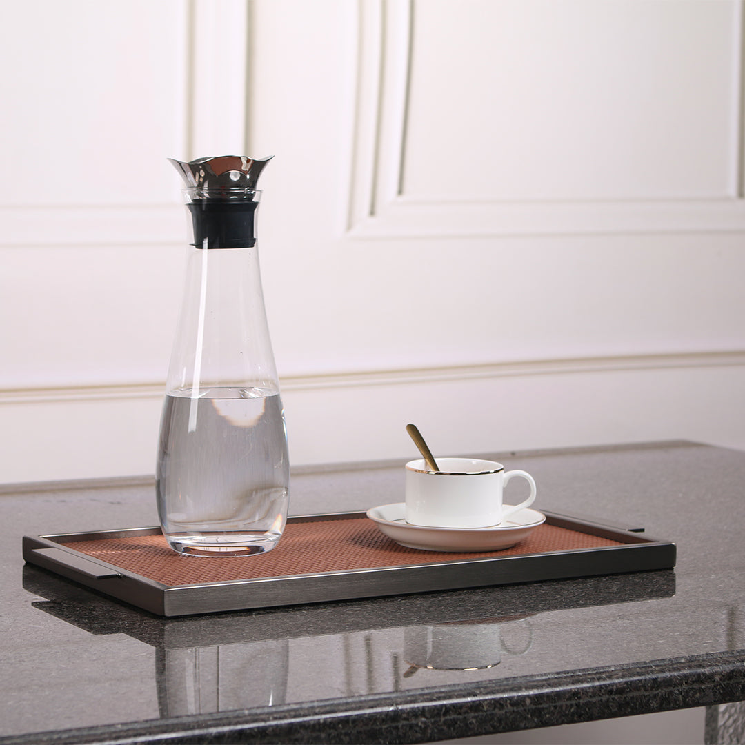 Brown leather and metal tray by Beacon, rectangular with sleek design, perfect for serving or decorative use.