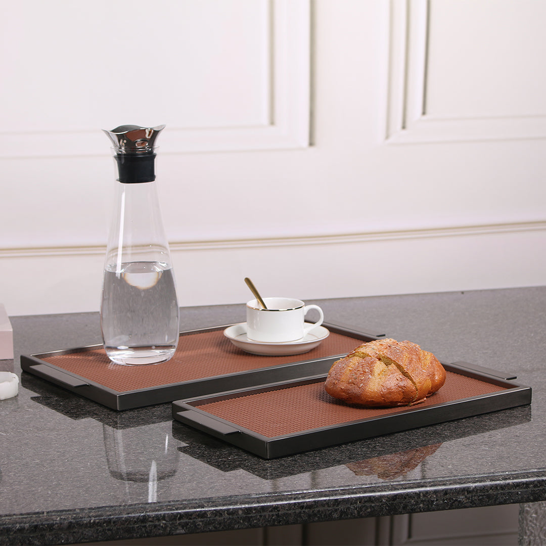 Brown leather and metal tray by Beacon, rectangular with sleek design, perfect for serving or decorative use.