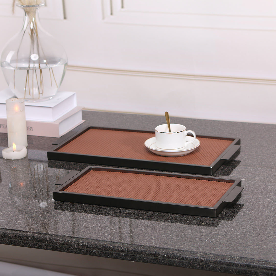 Brown leather and metal tray with handles, rectangular design, perfect for serving or decorative use.