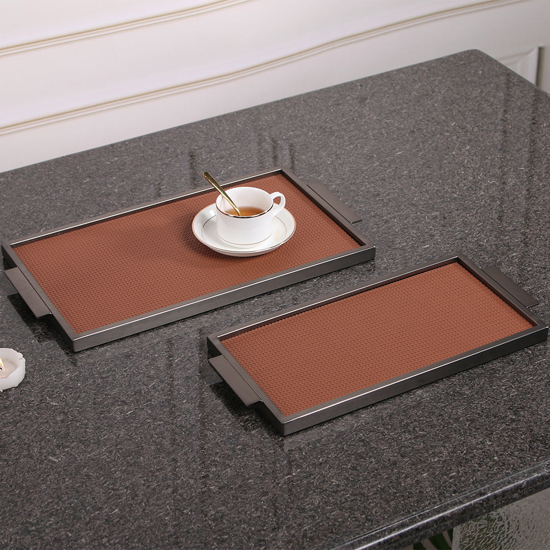 Brown leather and metal tray by Beacon, rectangular with sleek design, perfect for serving or decorative use.