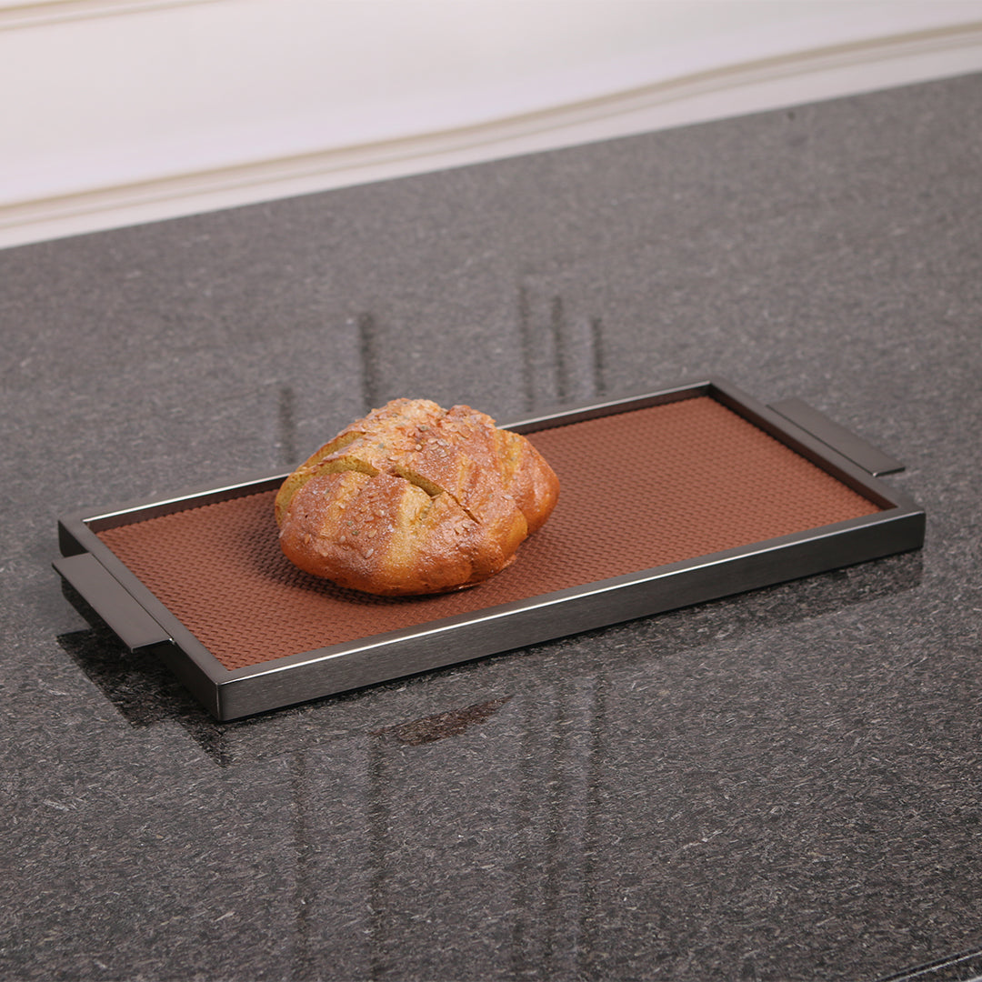 Brown leather and metal tray with handles, rectangular shape, stylish design, ideal for serving or decor by Beacon.