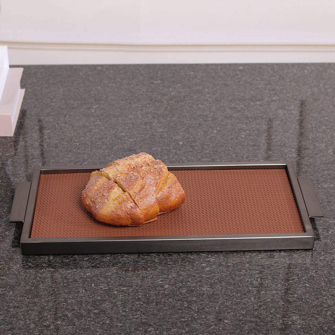 Brown leather and metal tray by Beacon, with a sleek rectangular design, ideal for serving or decorative use.