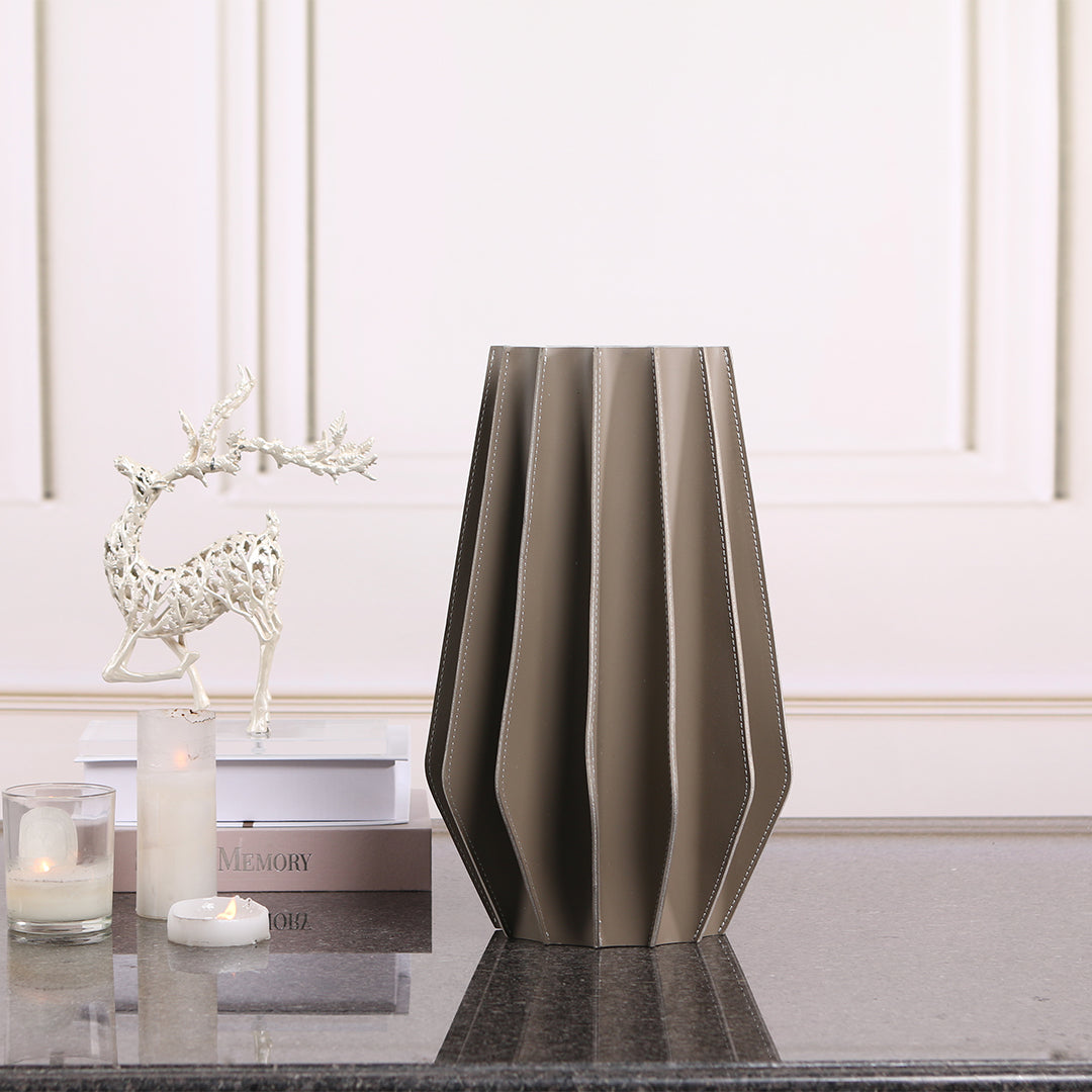 Leather vase by BEACON, dry and fresh finish, modern design, featuring smooth leather surface and elegant shape.