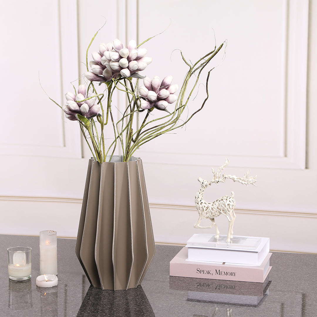 Leather vase by BEACON with a sleek, modern design, suitable for dry or fresh flowers, featuring smooth leather surface.