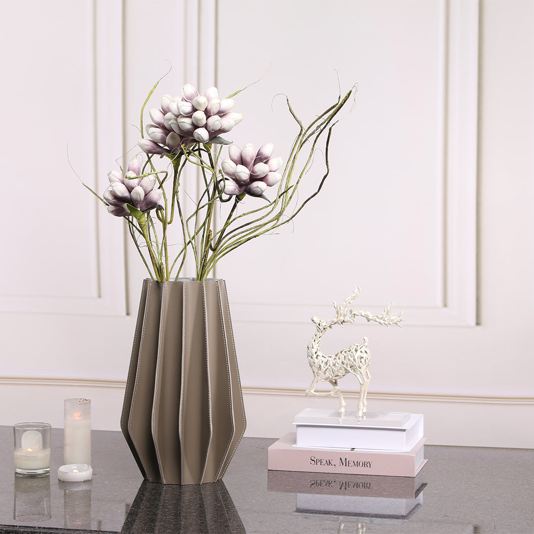 Leather vase from BEACON, dry and fresh design, featuring a sleek, textured leather surface ideal for modern floral arrangements.
