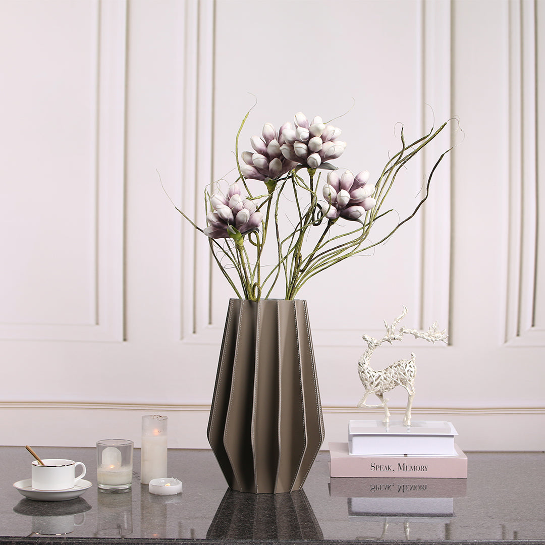 Leather Vase Dry & Fresh by BEACON, a stylish vase with a textured leather exterior, designed for decorative use.