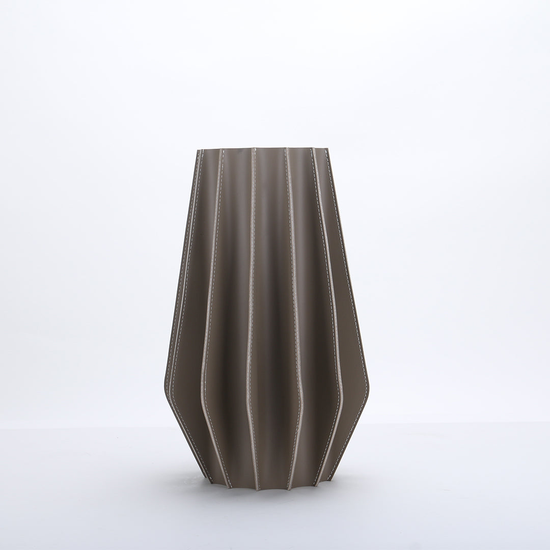 Leather vase by BEACON, dry and fresh style, with a sleek, textured leather surface, designed for decorative vases.