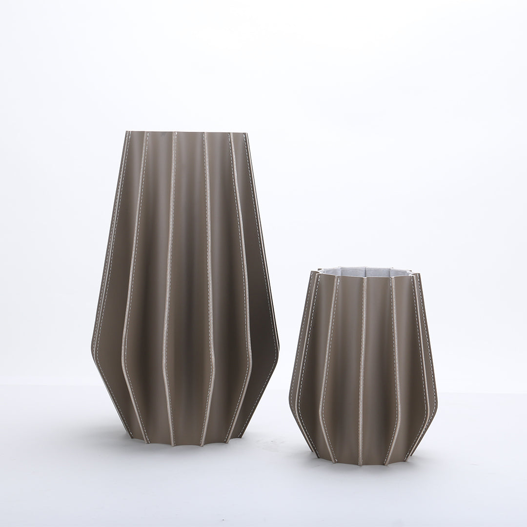 Leather vase by BEACON with dry and fresh leather textures, designed as a stylish decorative vase for home decor.