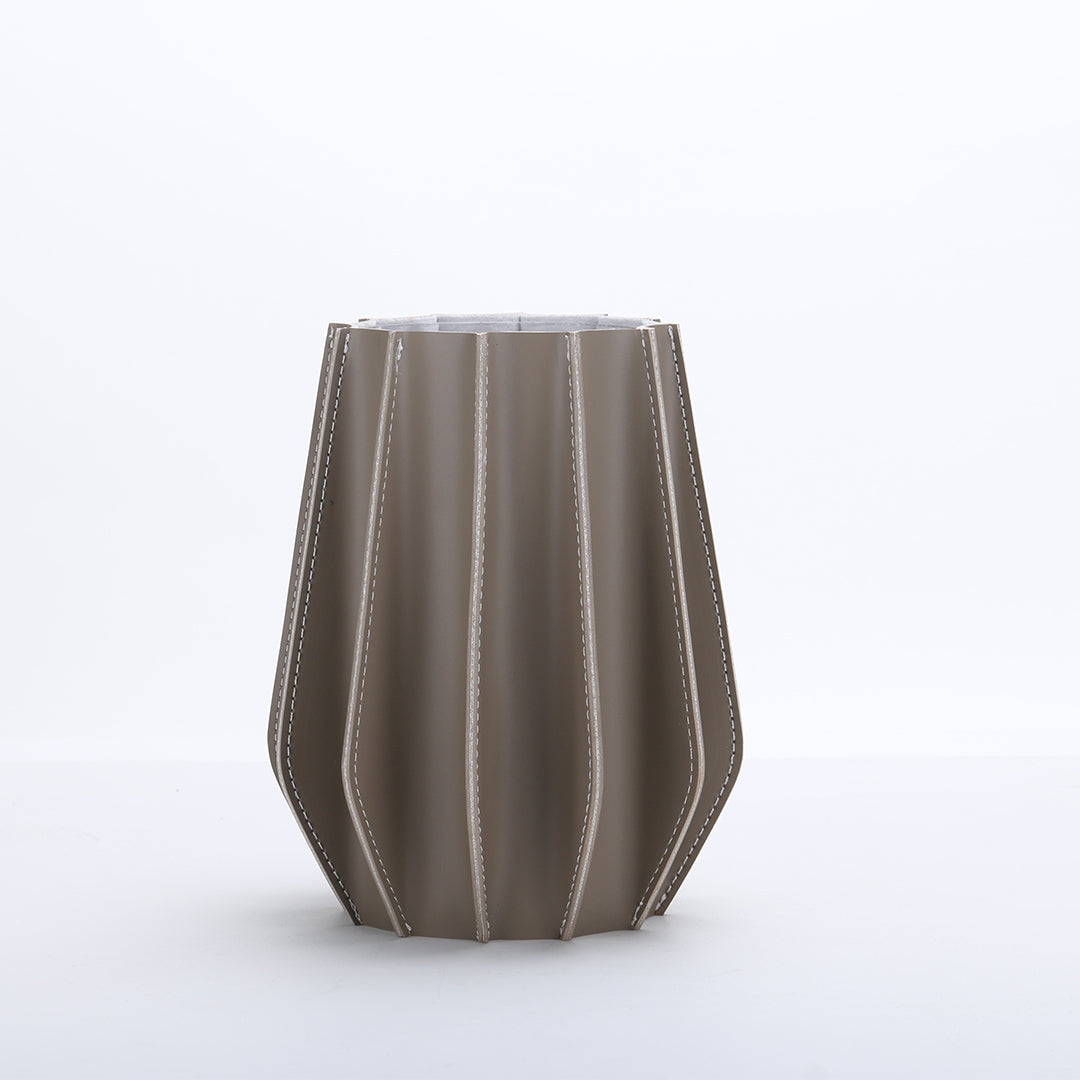 Leather vase from BEACON, designed for dry and fresh flowers, featuring a textured leather exterior and elegant shape.