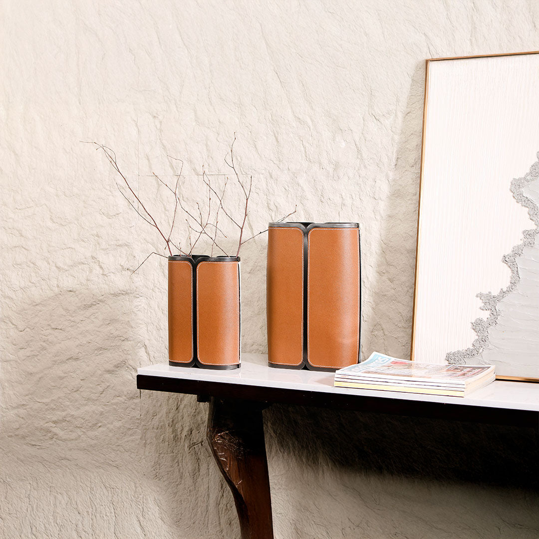 Leather wrapped vase in black by BEACON, featuring a sleek, modern design perfect for contemporary home decor.