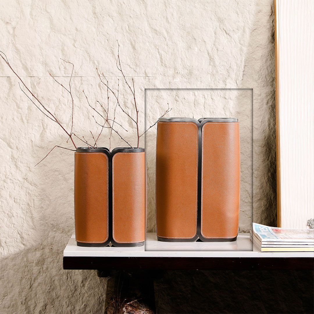 Leather-wrapped BEACON Vase L with a sleek, modern design, featuring a smooth leather exterior and a durable ceramic base.