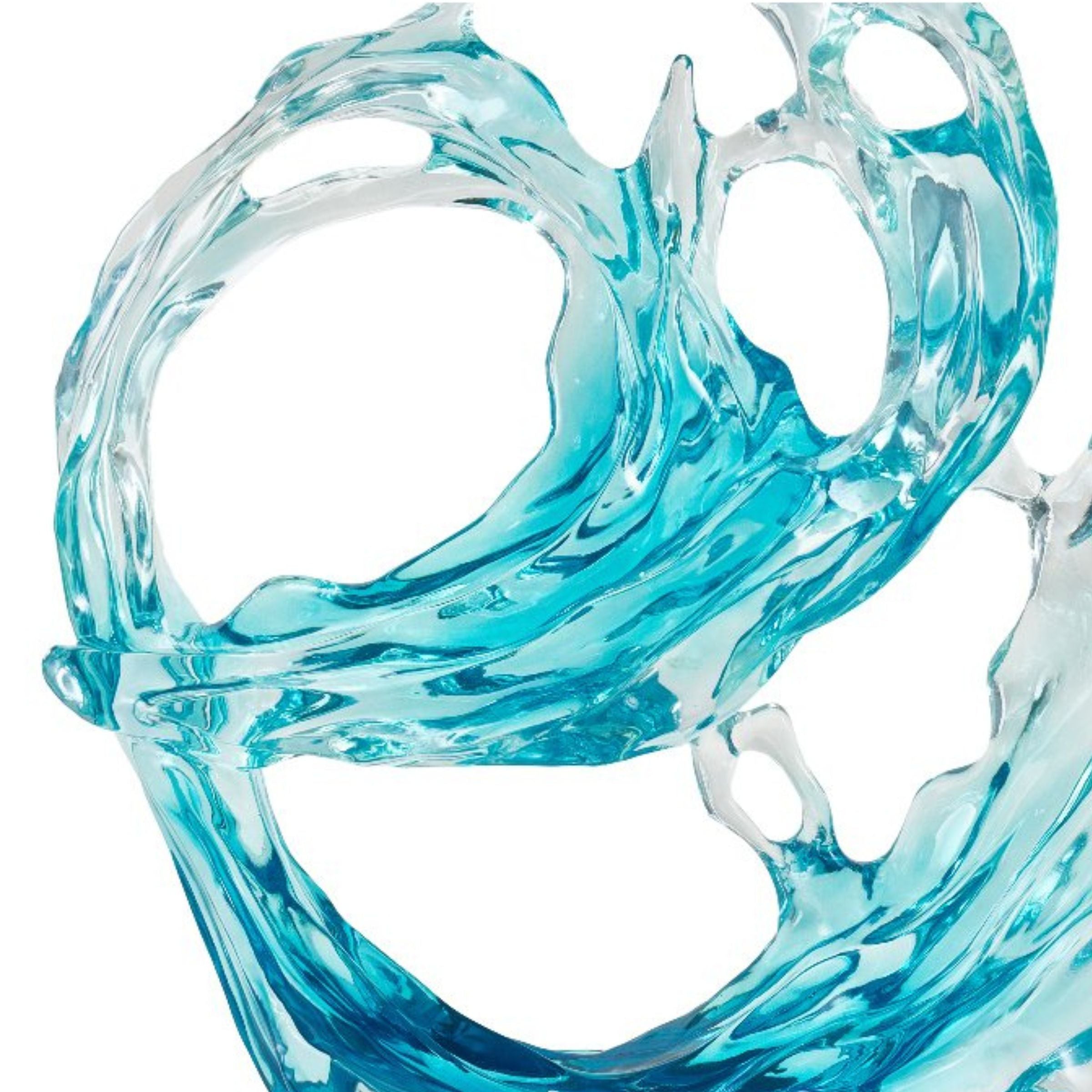 Light blue and clear abstract sculpture by BEACON, a stylish home decor figurine with modern, flowing design.