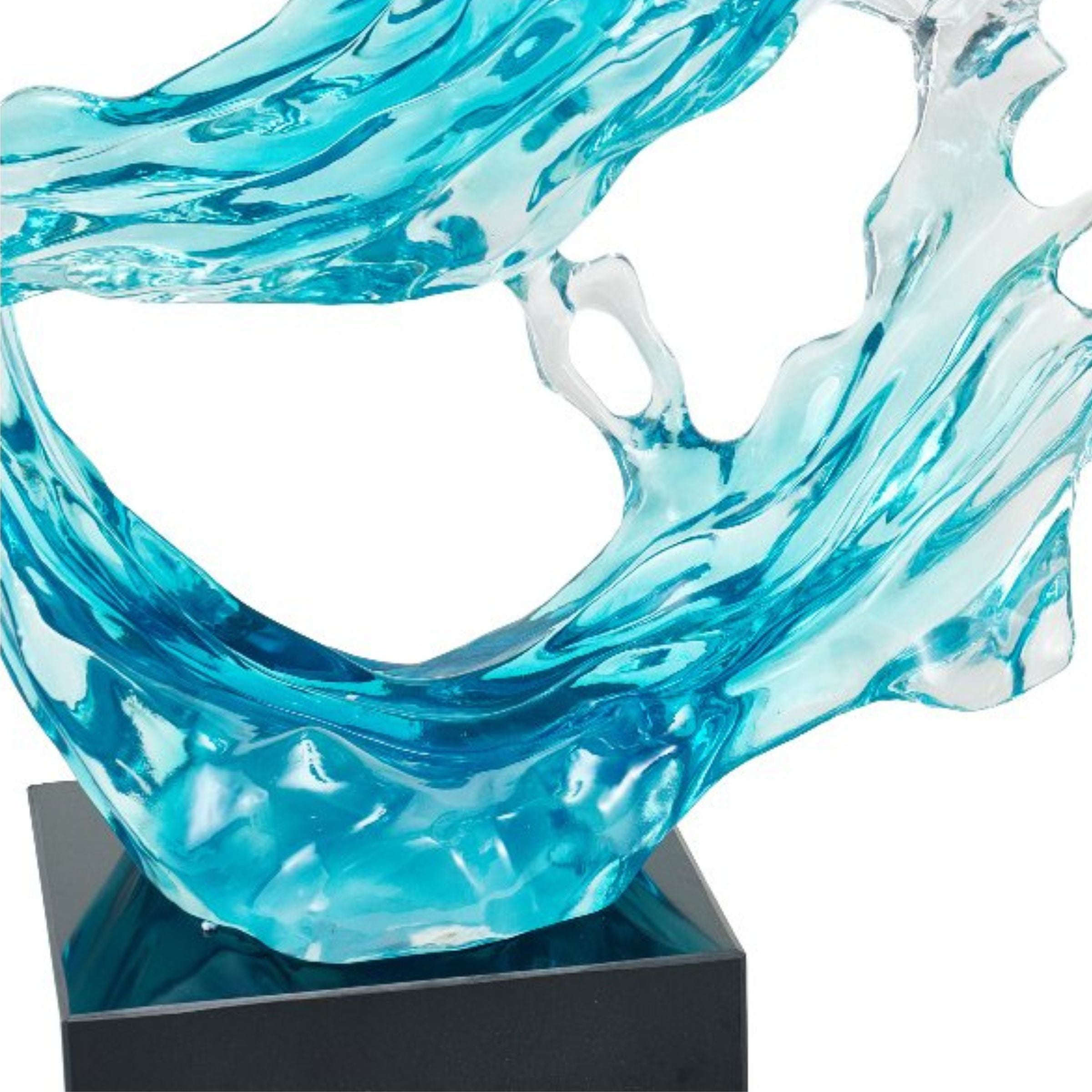 Light blue and clear abstract sculpture from BEACON home decor figurines, modern decorative art piece with flowing shapes.