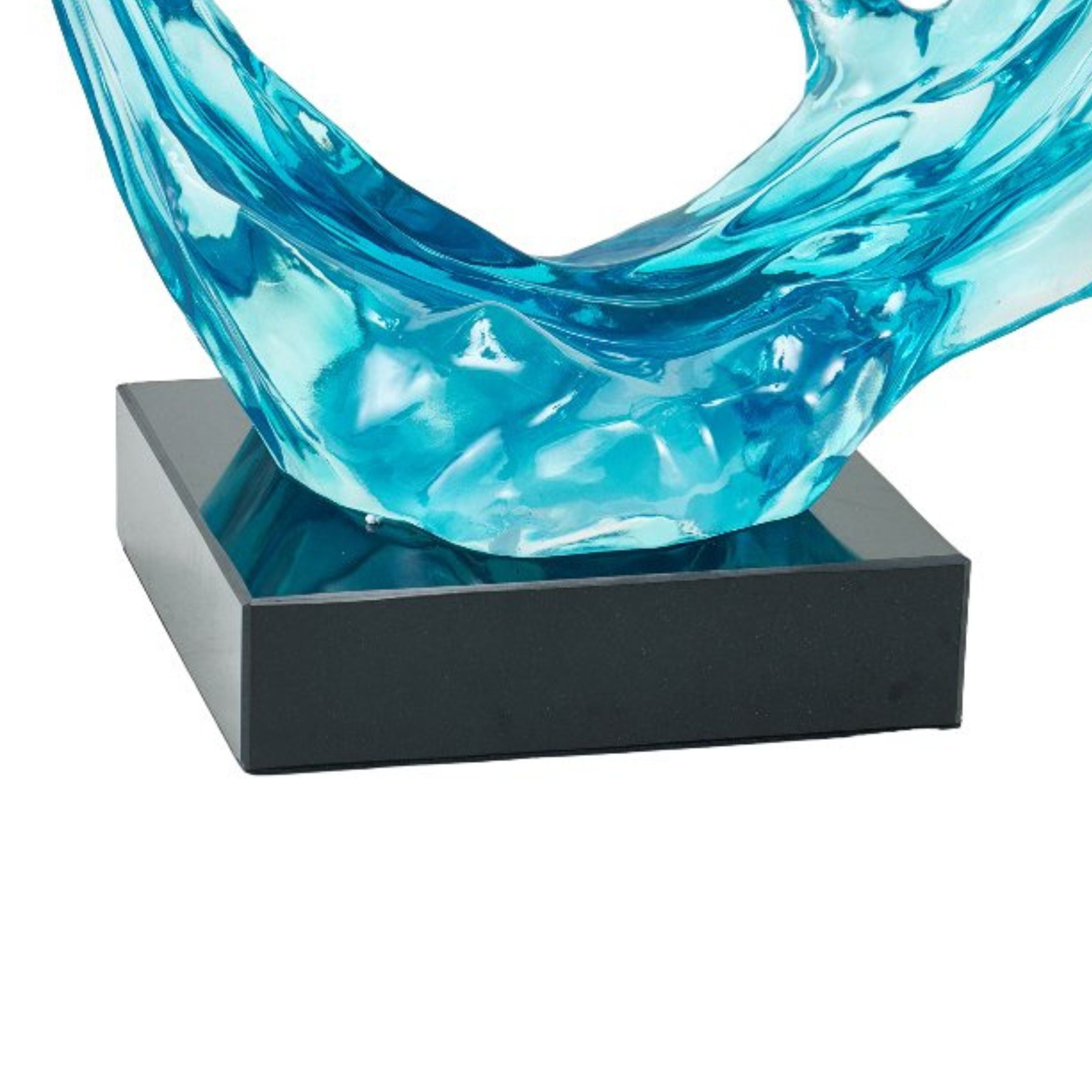 Light blue and clear abstract sculpture by BEACON, decorative home decor figurine with modern, artistic design.