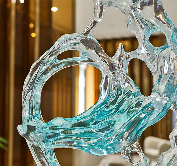 Light blue and clear abstract sculpture by Beacon, modern home decor figurine with flowing, artistic design.