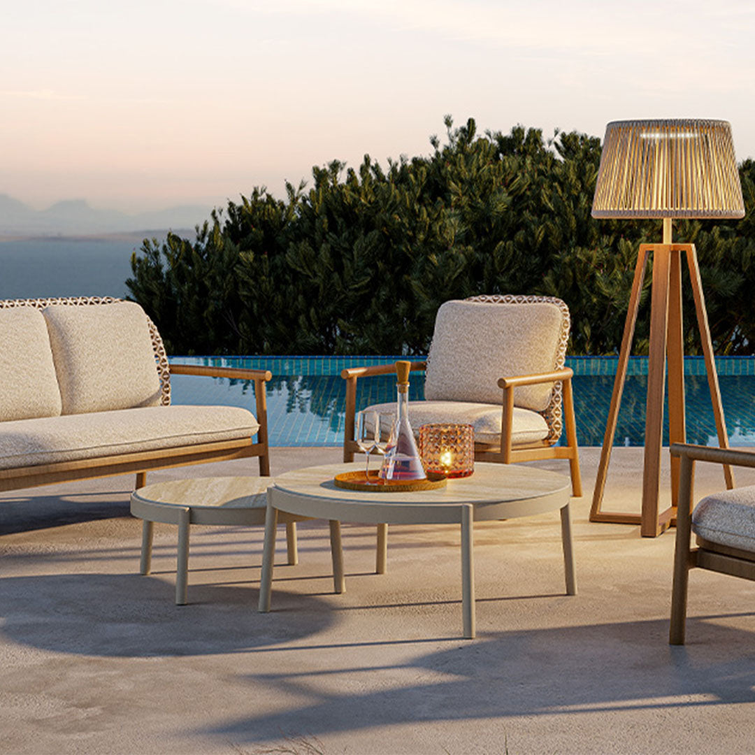 Beacon Lille coffee table with ceramic top, outdoor table in a modern design, shown in a natural outdoor setting.