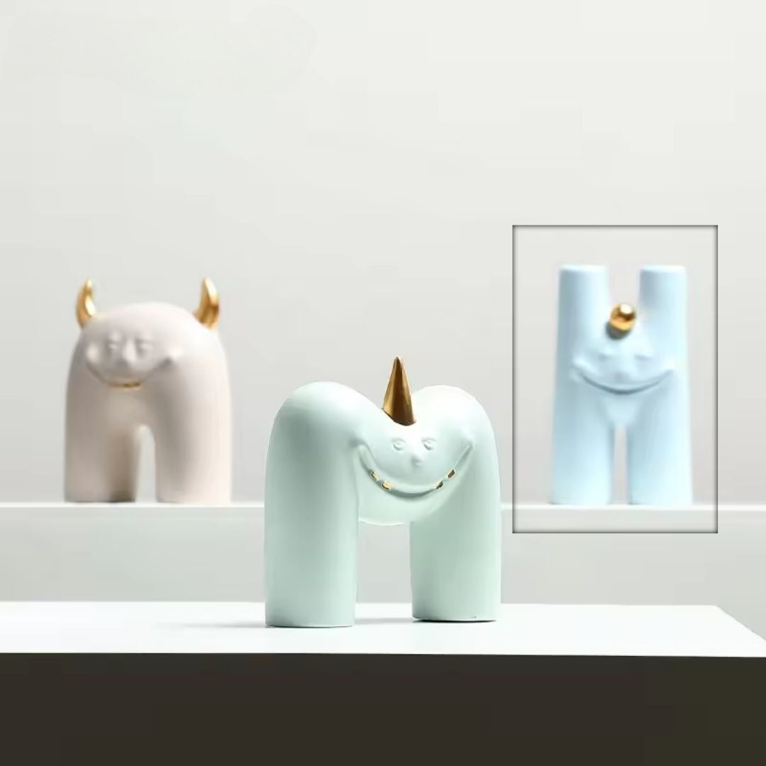 Little Monster H figurine by BEACON, a playful home decor figurine with whimsical monster design.