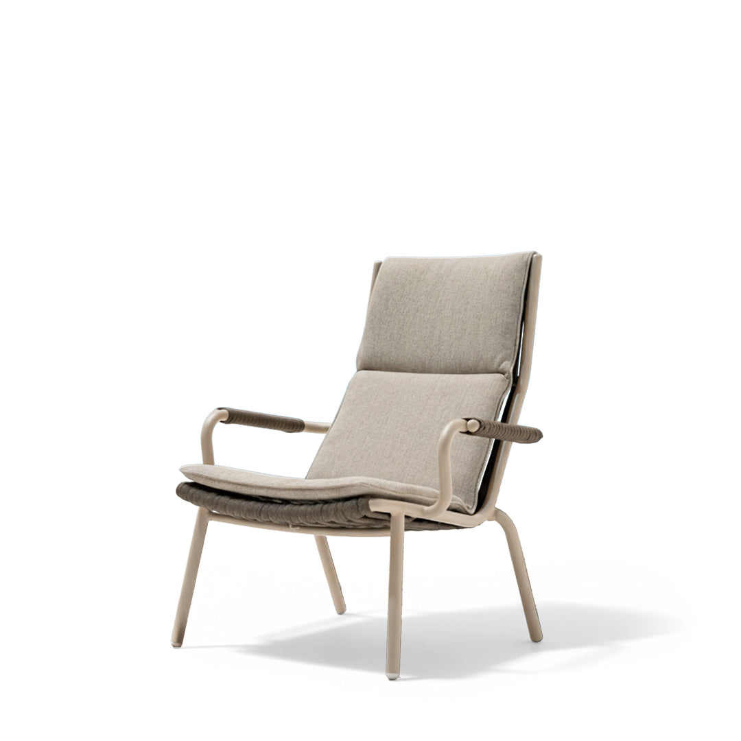 Outdoor high-back lounge armchair by Beacon with cushioned seat and armrests, perfect for relaxing outdoors.