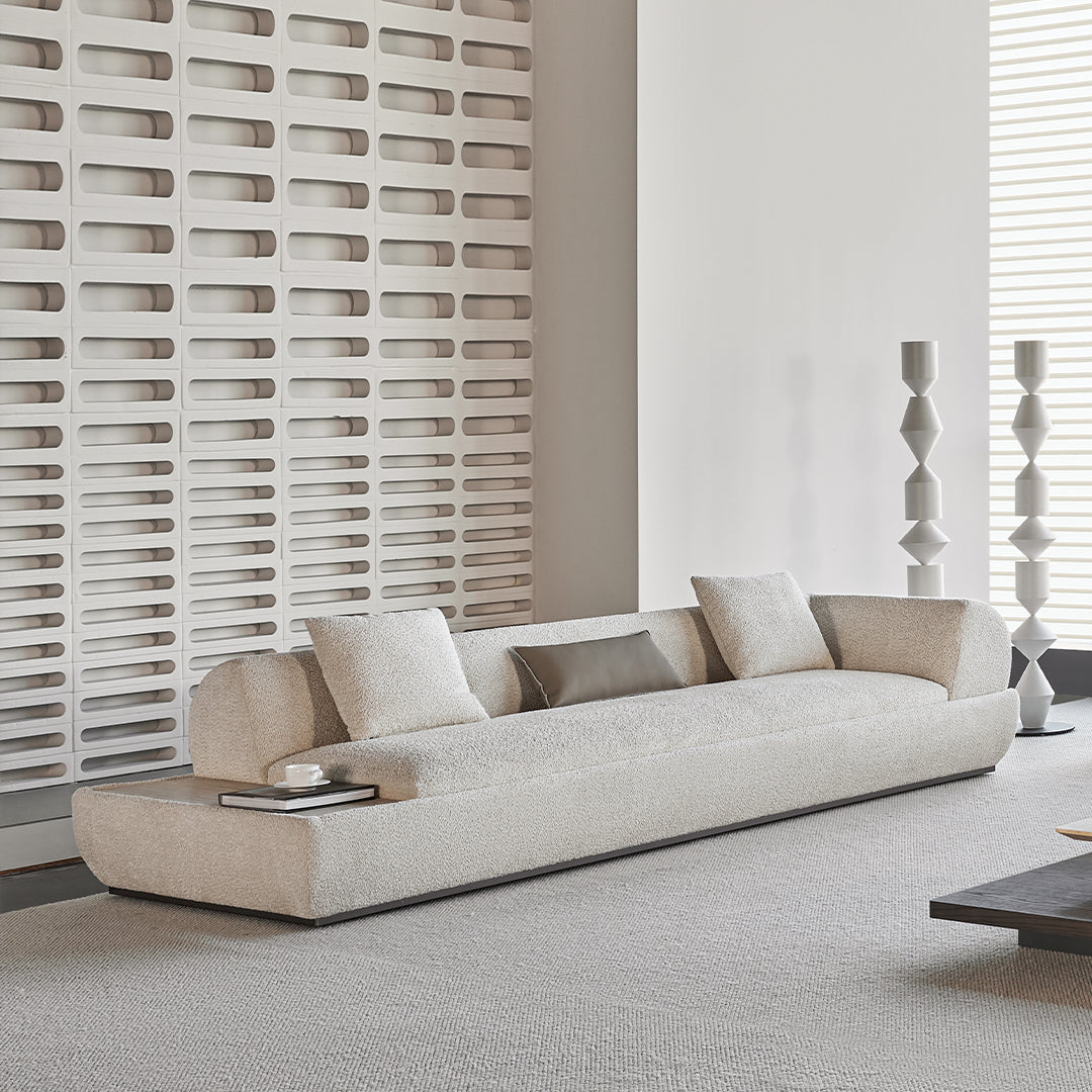 Lylia 2-seater right arm sofa module with travertine side table by BEACON, featuring cream upholstery and modern design.