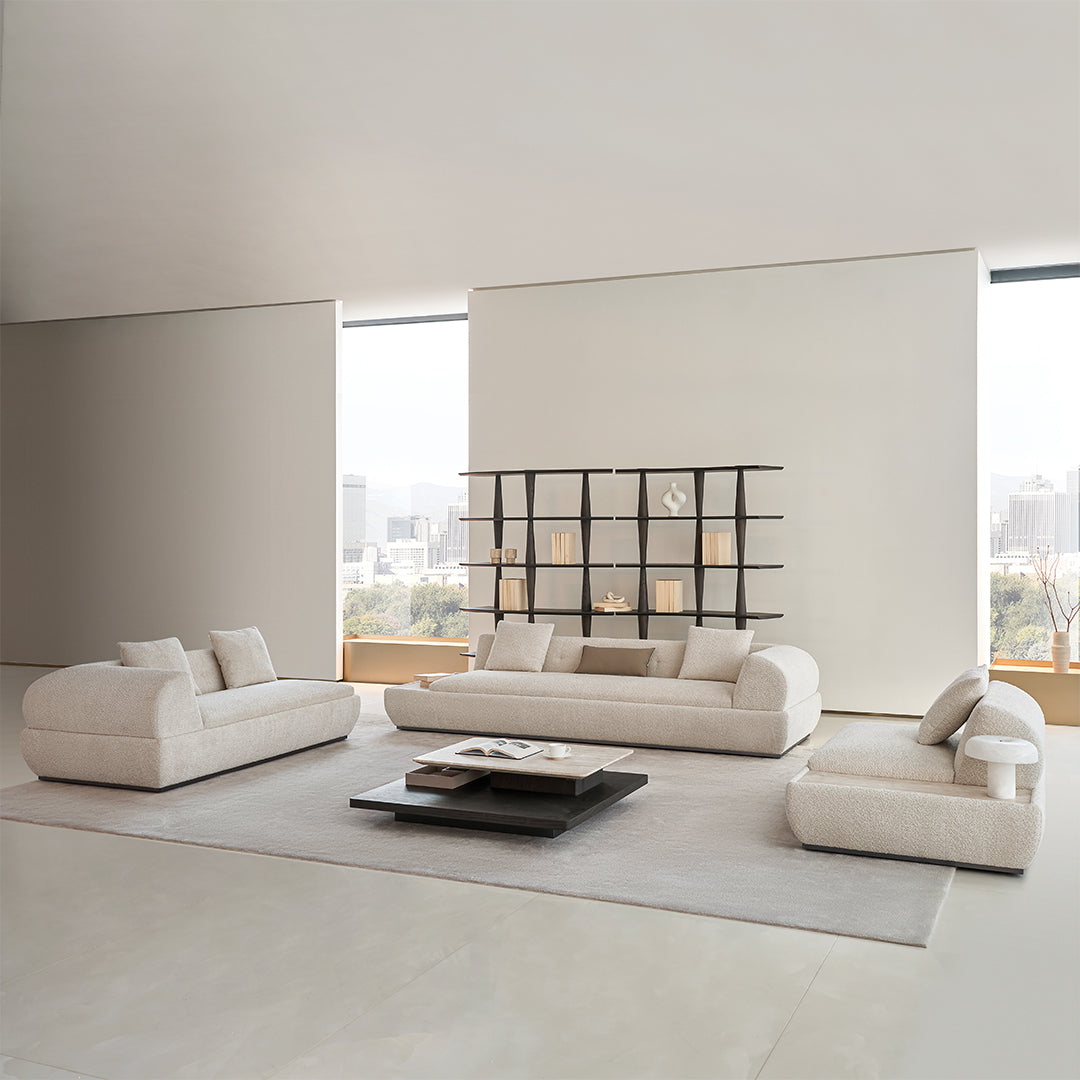 Lylia chaise module sofa with matching travertine side table by BEACON, modern living room furniture with stylish design.