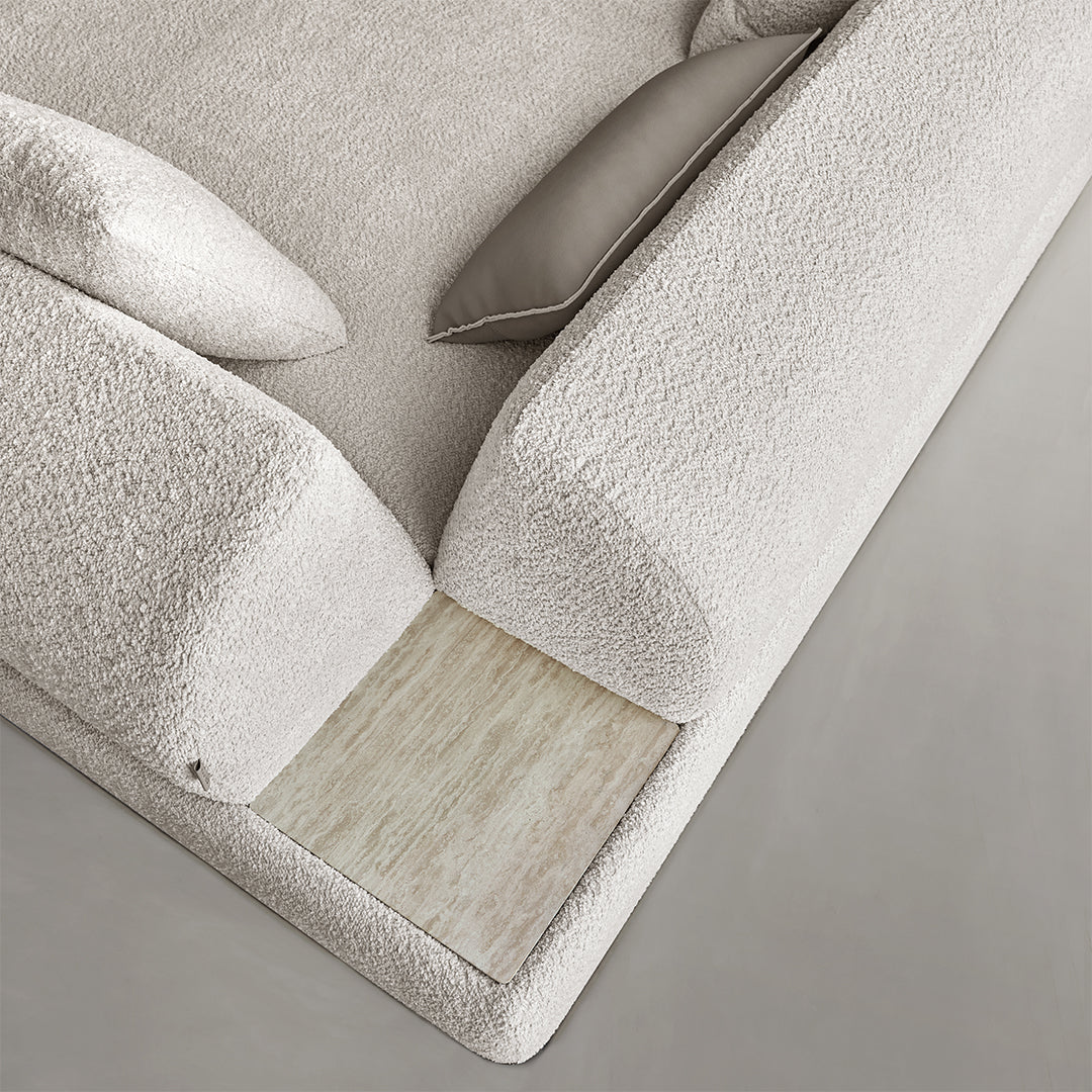 Lylia chaise module with travertine side table by BEACON, showcasing modern sofa with elegant side table and plush cushions.