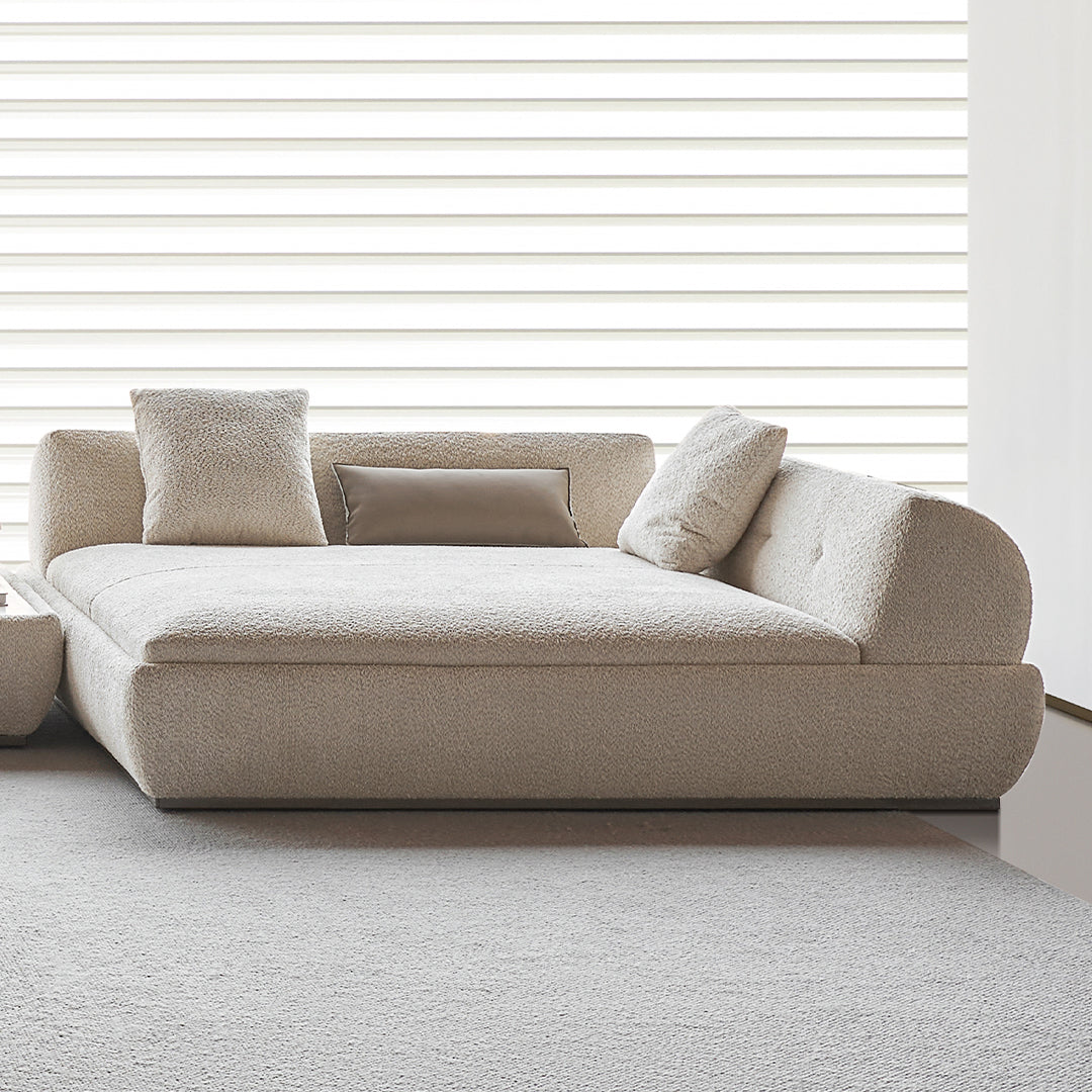 Lylia chaise module with matching travertine side table from BEACON Sofas, modern living room furniture.
