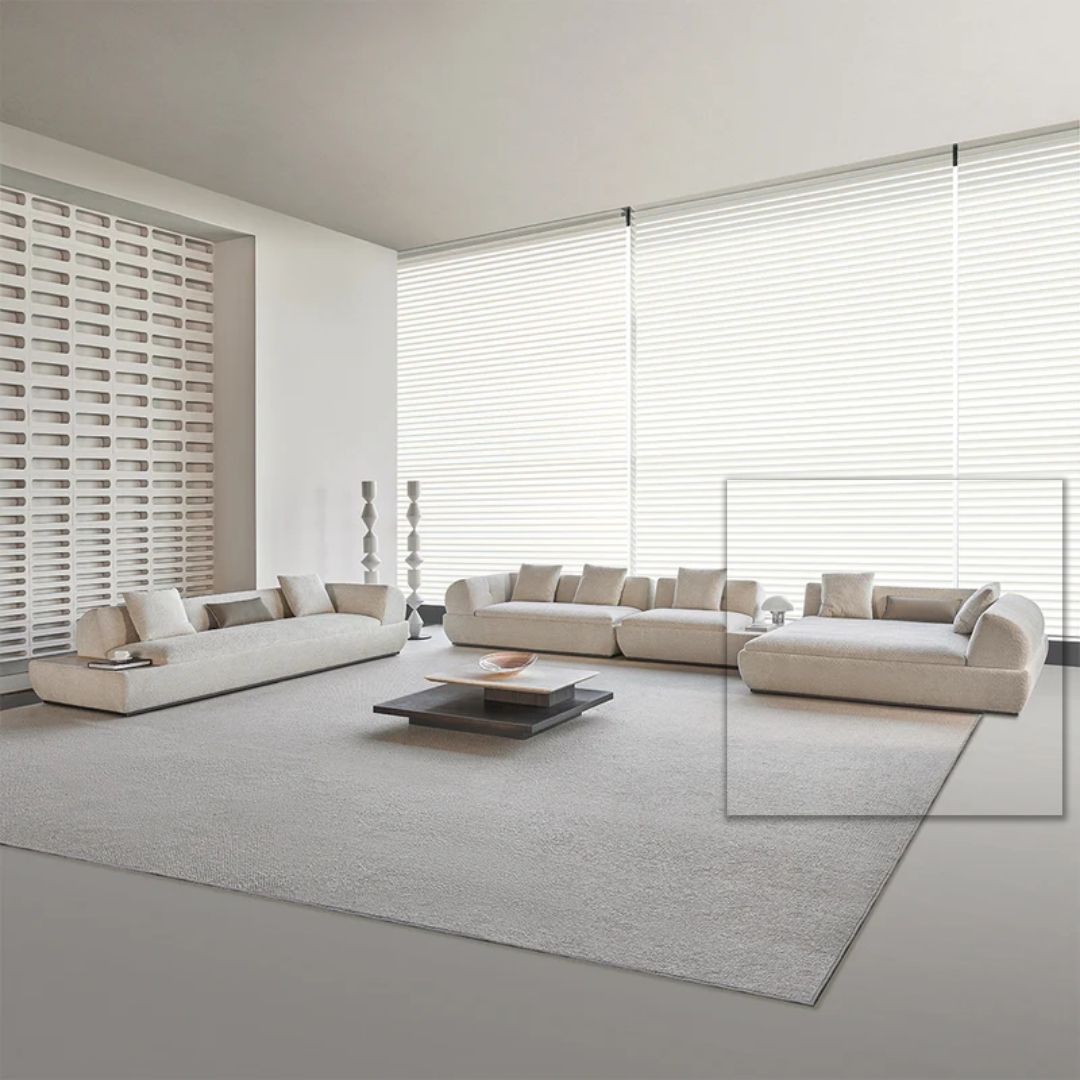 Lylia chaise module sofa with a matching travertine side table by BEACON, modern living room furniture, close-up of seating and table.