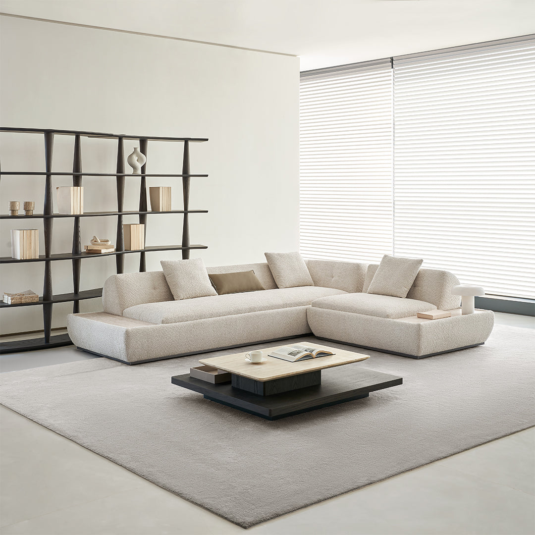 Lylia single seater sofa module with a matching travertine side table by BEACON, modern design, in a stylish living room setting.