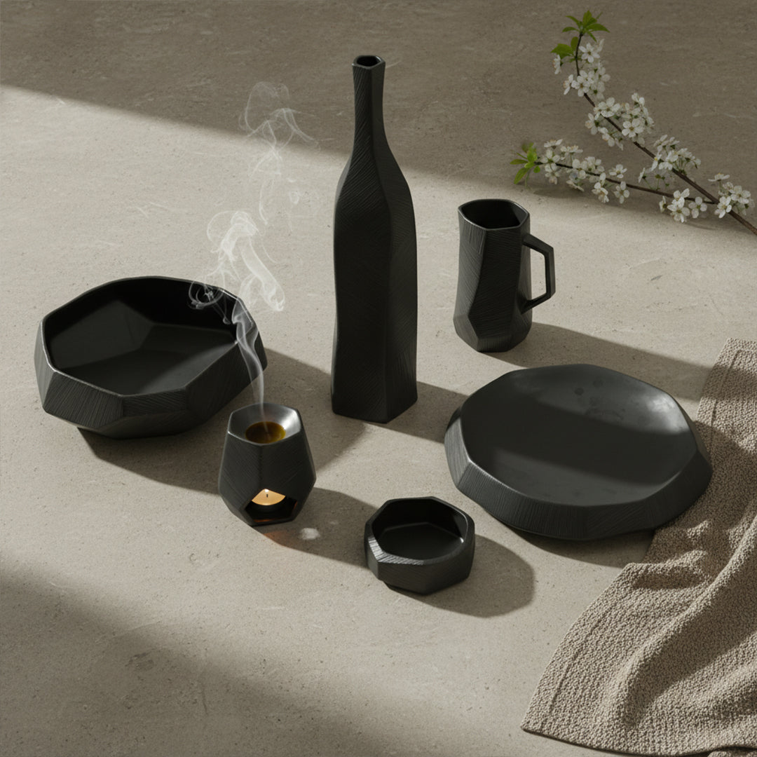 Black volcanic chiseled ceramic jug by Mingxiang Ceramics, with textured, rugged surface and traditional drinkware design.