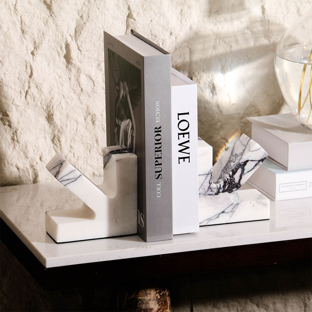 Elegant marble bookend from BEACON, featuring a sleek, polished design ideal for supporting books on a shelf.