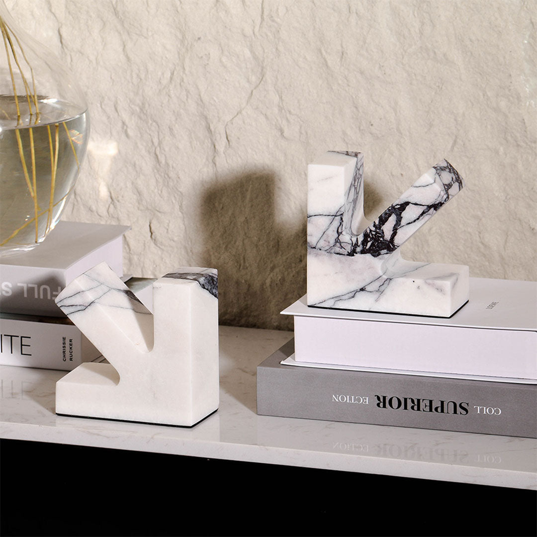 Marble bookend from BEACON featuring a sleek, polished design, ideal for holding books upright on a shelf.