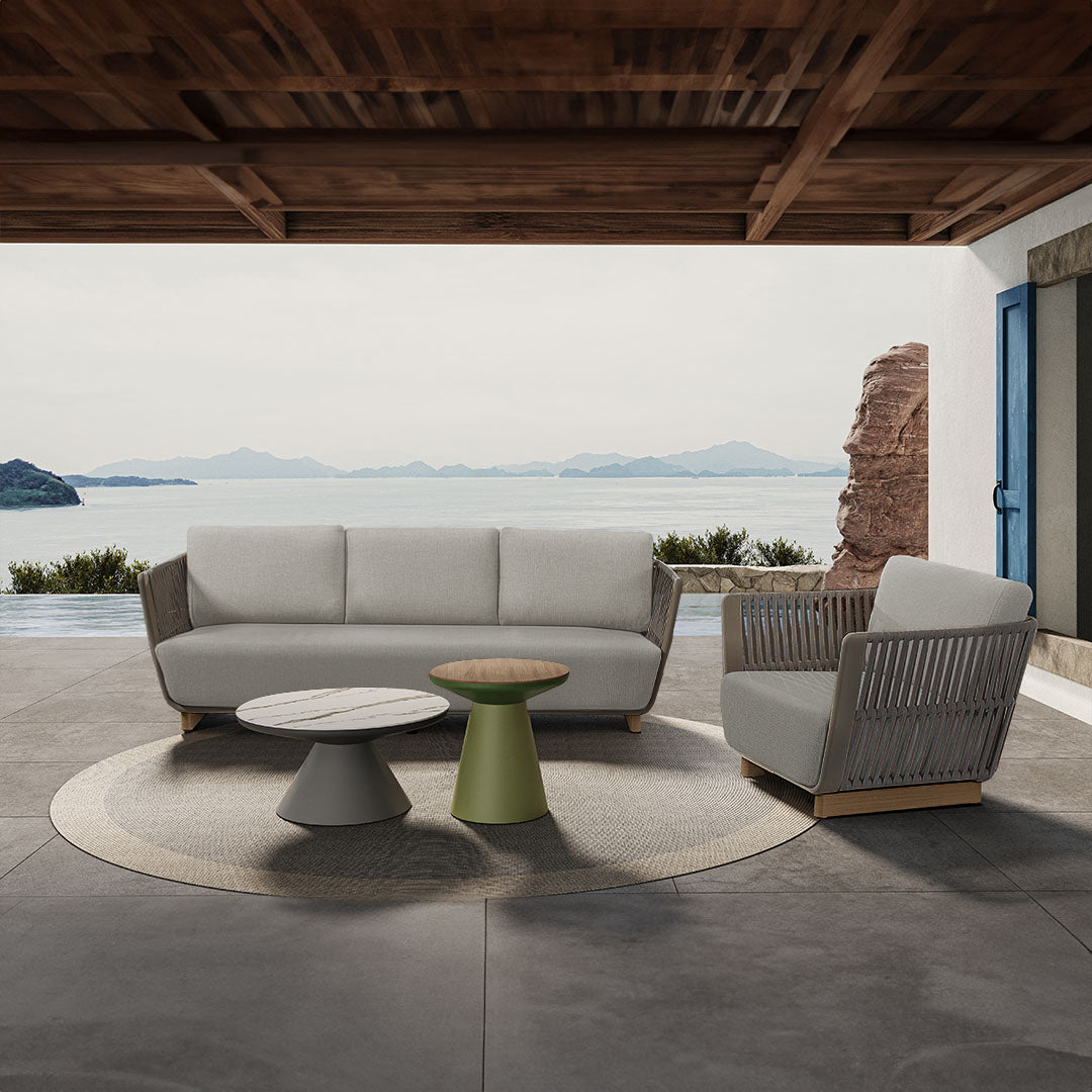 BEACON Marrakech outdoor/indoor armchair with woven design, wooden legs, and cushioned seat for stylish comfort.