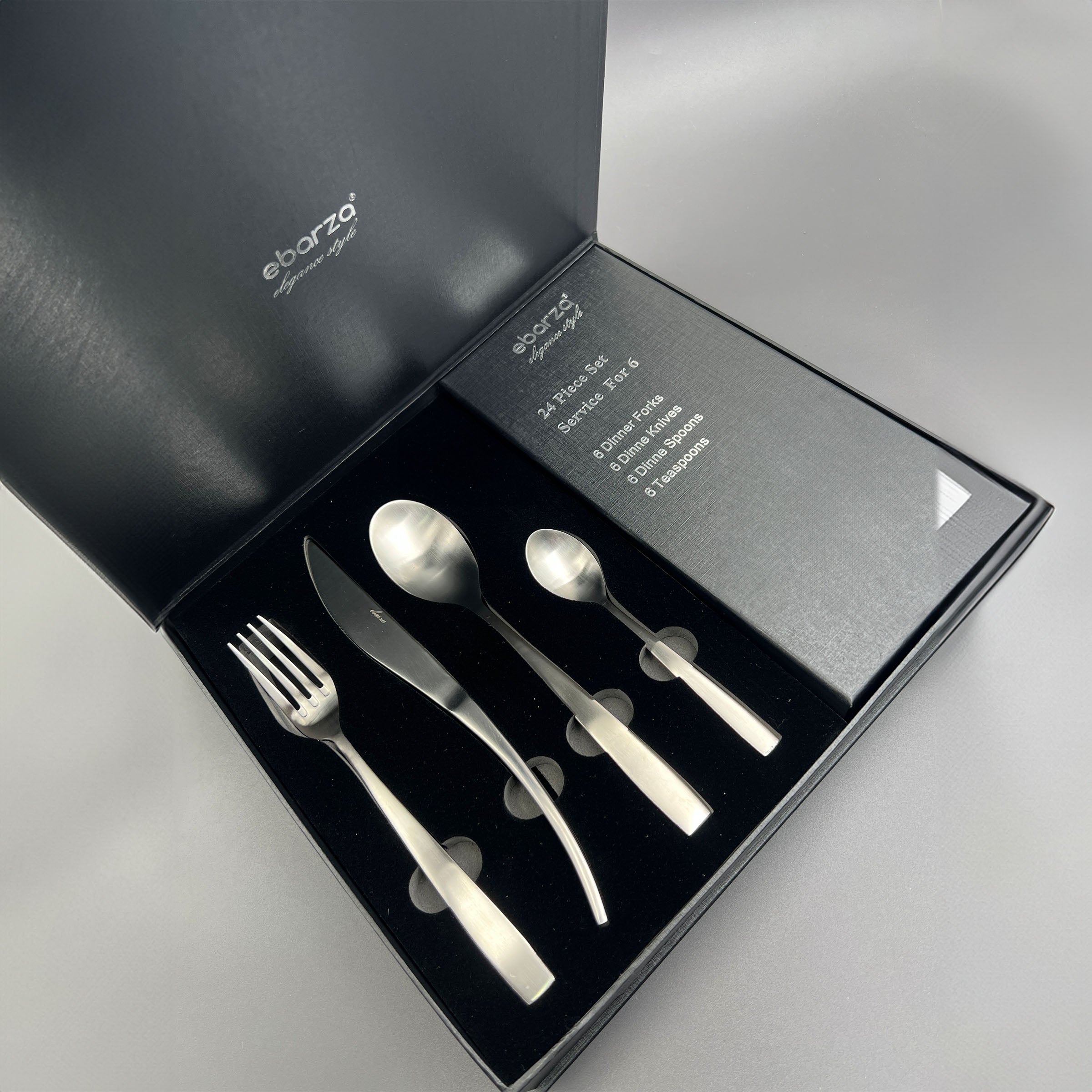Metro Chic 24-piece matte silver cutlery set by BEACON, includes knives, forks, and spoons for elegant dining.