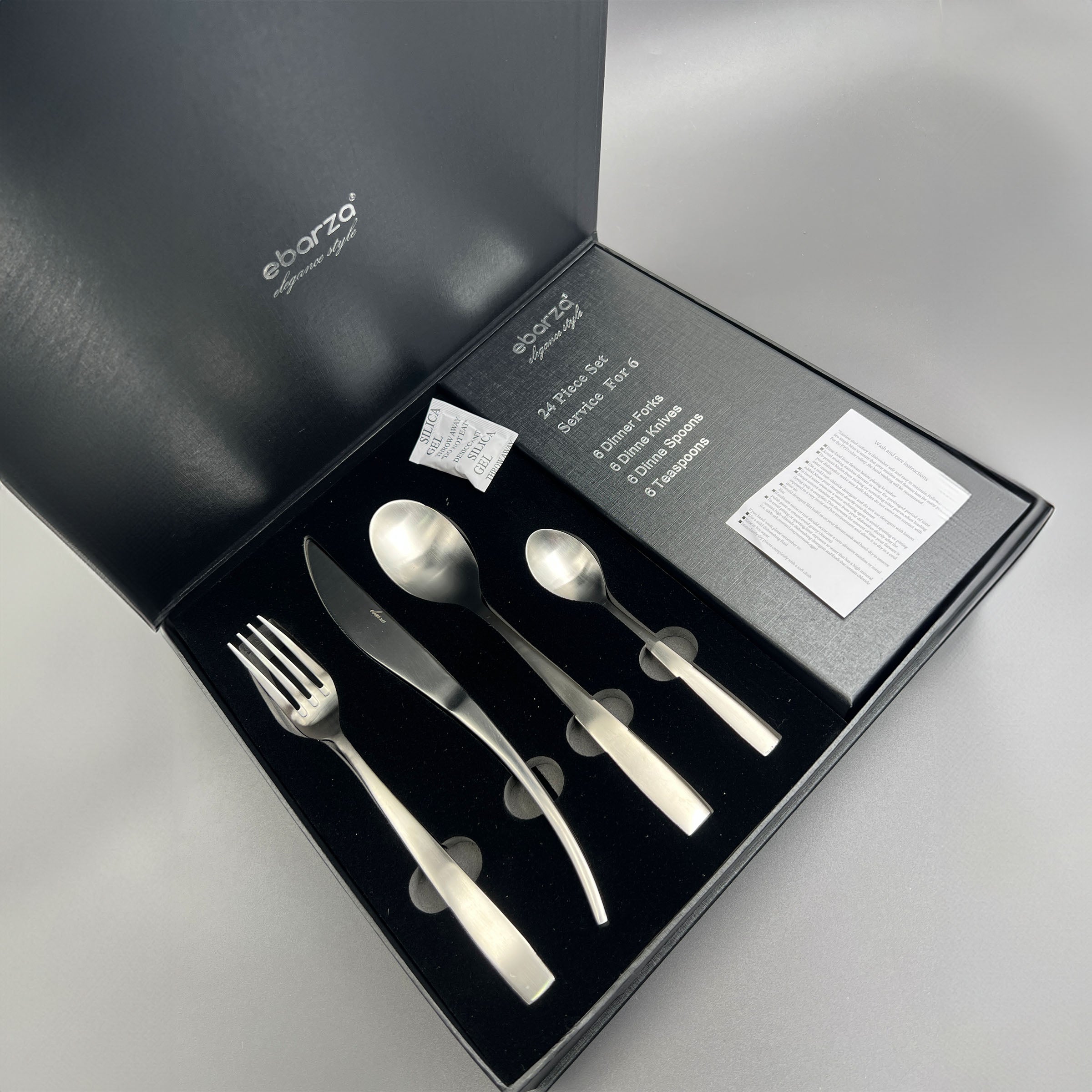Metro Chic 24-piece matte silver cutlery set by BEACON, includes knives, forks, spoons for elegant dining.