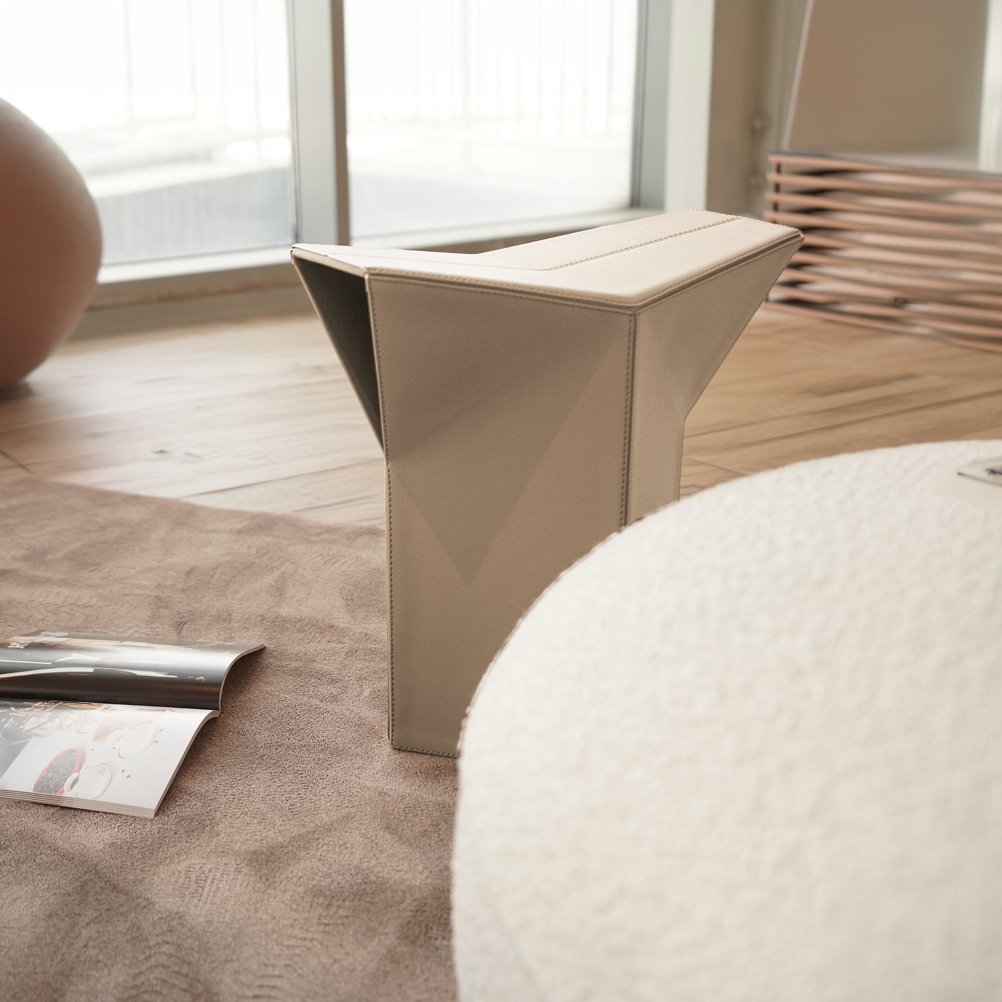 Beige microfiber saddle leather side table and low stool pouf by BEACON, versatile furniture for living room or lounge space.