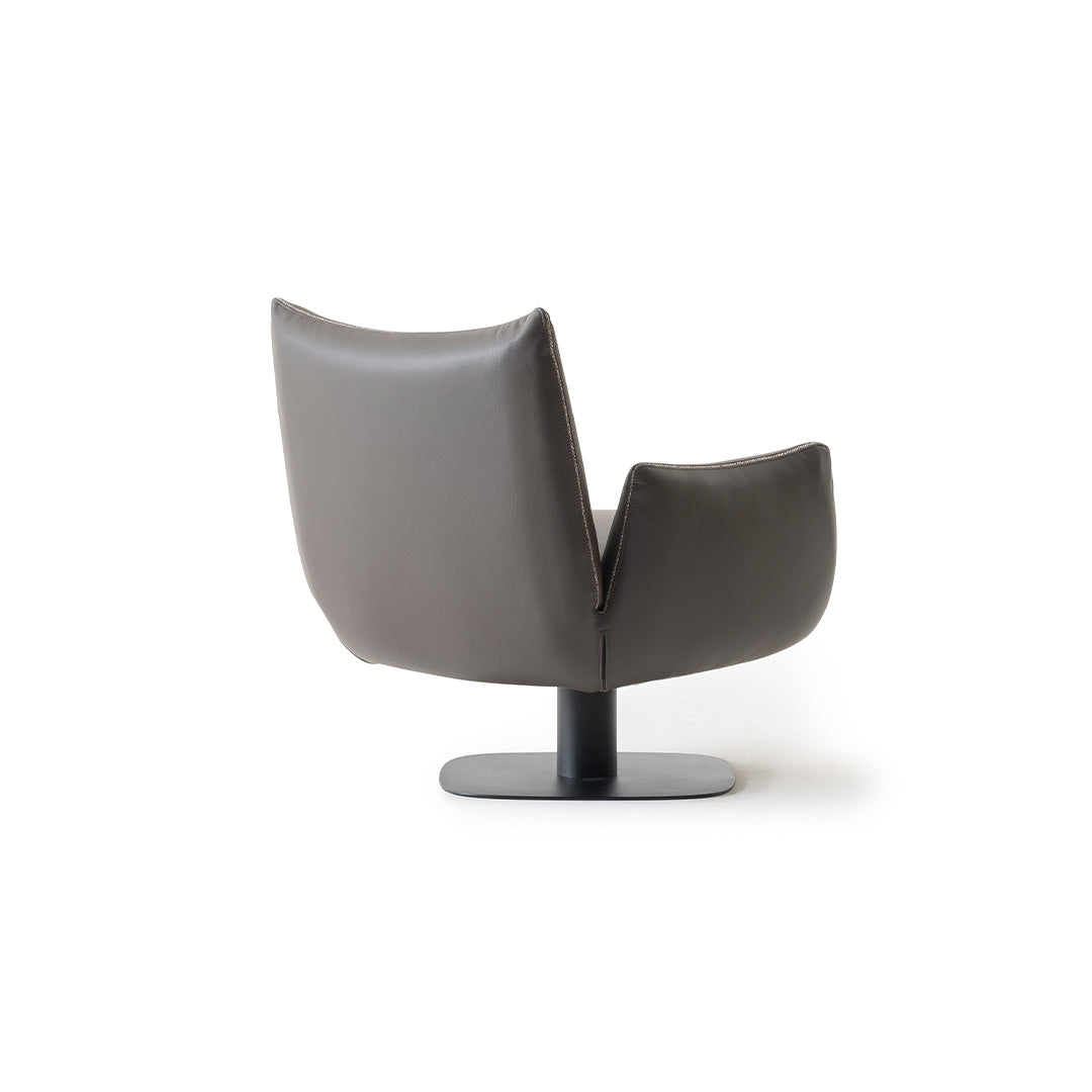 YOL LIVING MILA Amara armchair with plush fabric upholstery and modern design, shown in a cozy living room setting.