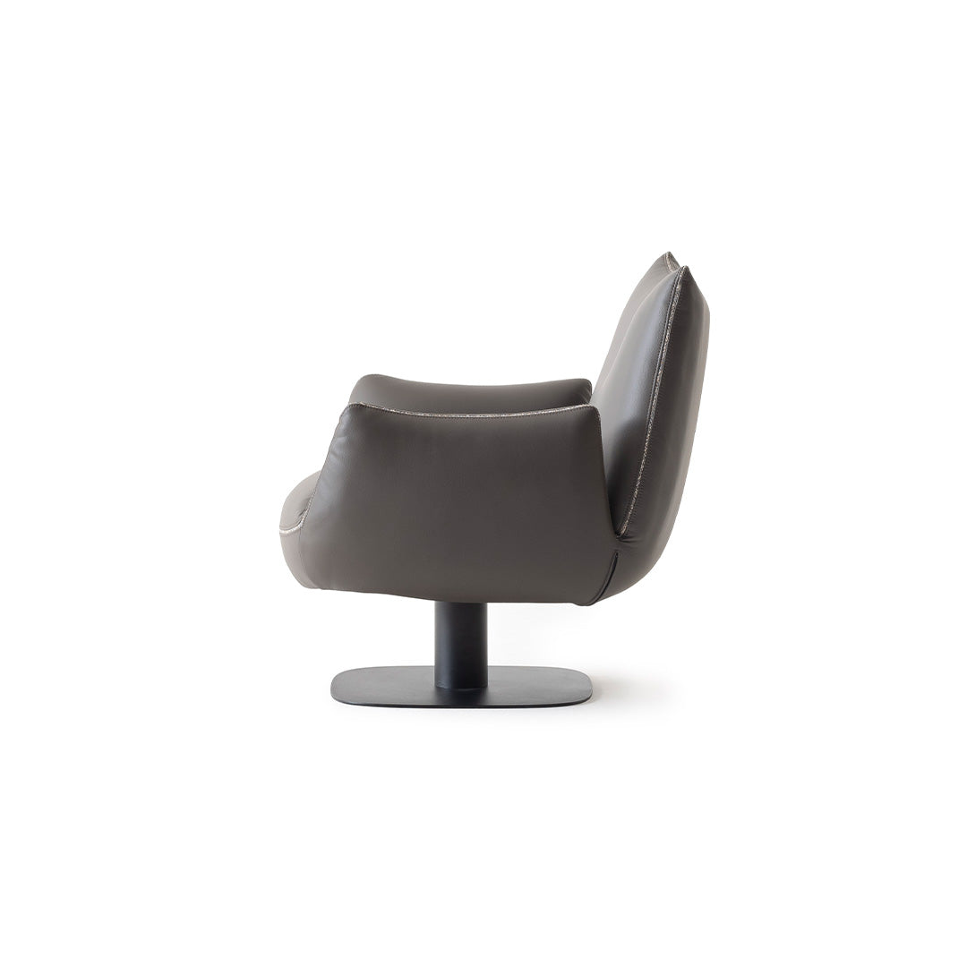 YOL LIVING Mila Amara armchair with plush fabric upholstery and modern design, featuring a comfortable curved back and armrests.