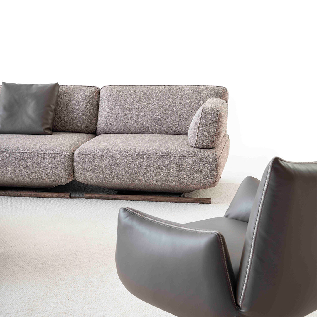 YOL LIVING MILA sofa module with right arm in a modern living room setting, showcasing the sofa's sleek design and fabric upholstery.
