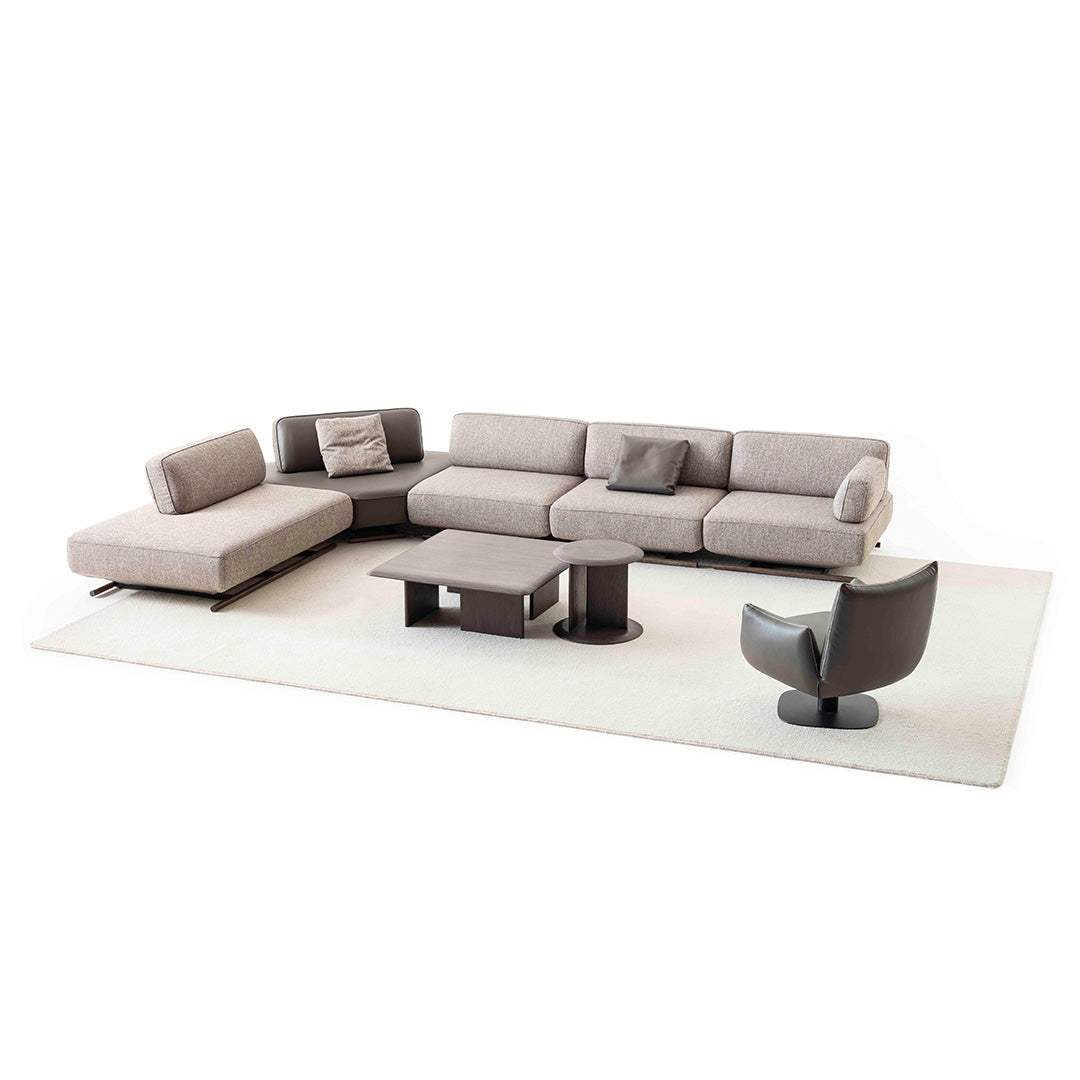 YOL LIVING MILA sofa module with right arm in a modern living room setting, showcasing its sleek design and fabric upholstery.