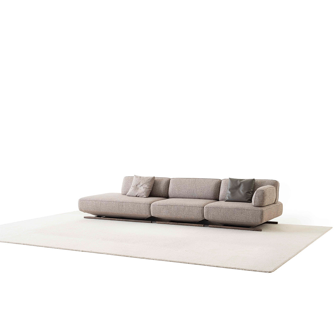 YOL LIVING MILA sofa module with right arm in a modern living room setting, showcasing the sleek design and fabric upholstery.
