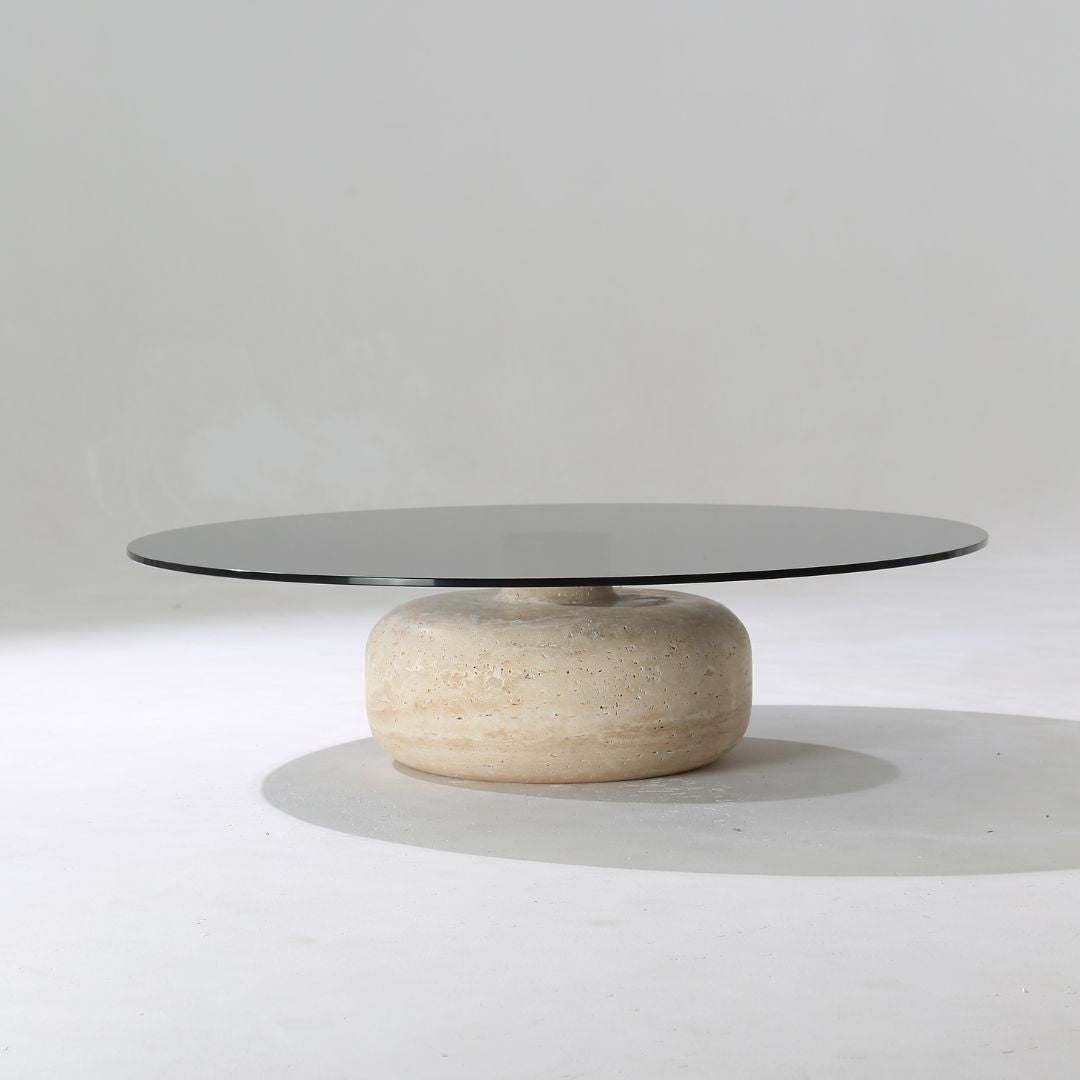 Minimal grey glass and travertine marble round coffee table by BEACON, modern design with sleek grey finish.