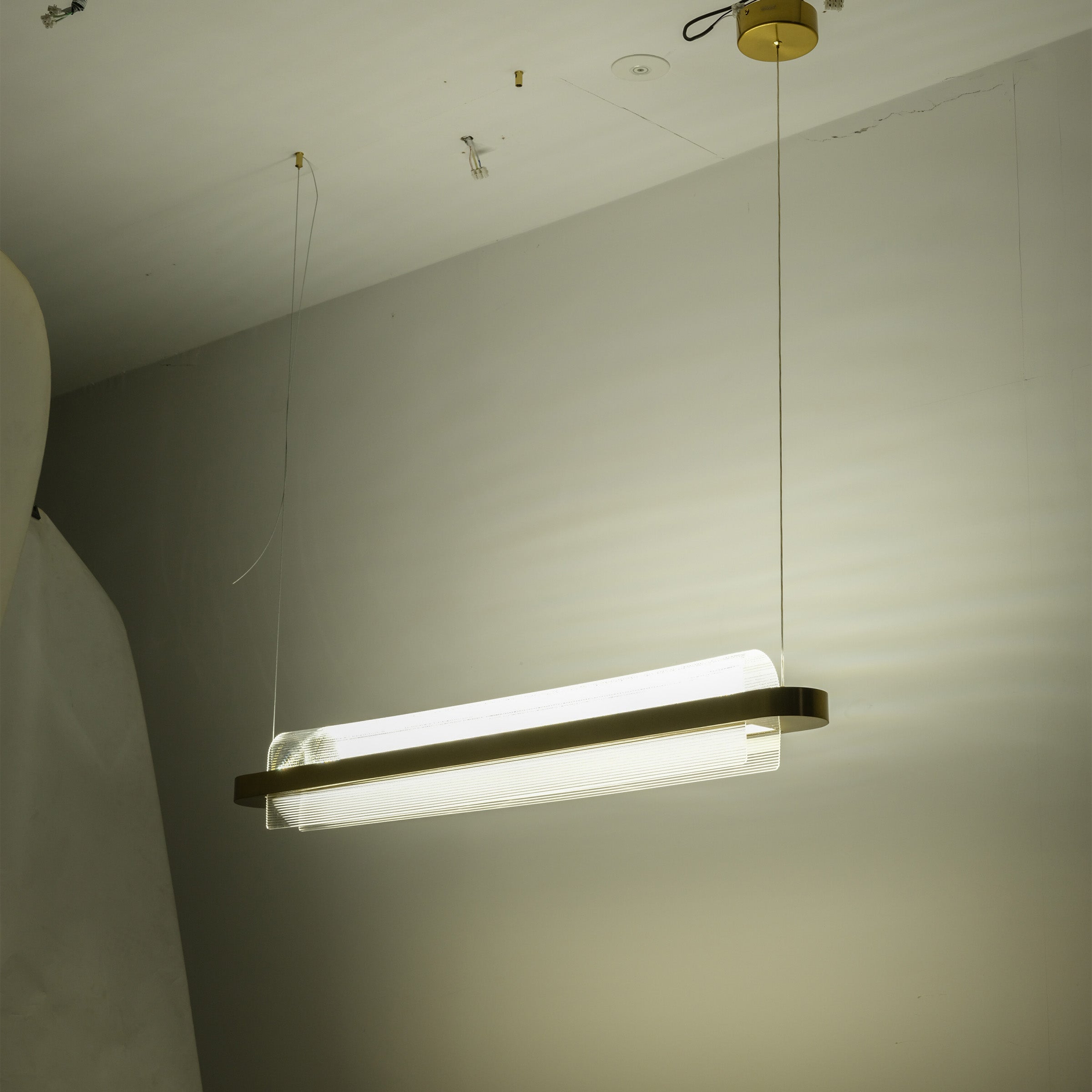 Molten Pearl Pendant Lamp by BEACON with a sleek, modern design, featuring a lustrous, pearl-like finish for stylish interior lighting.